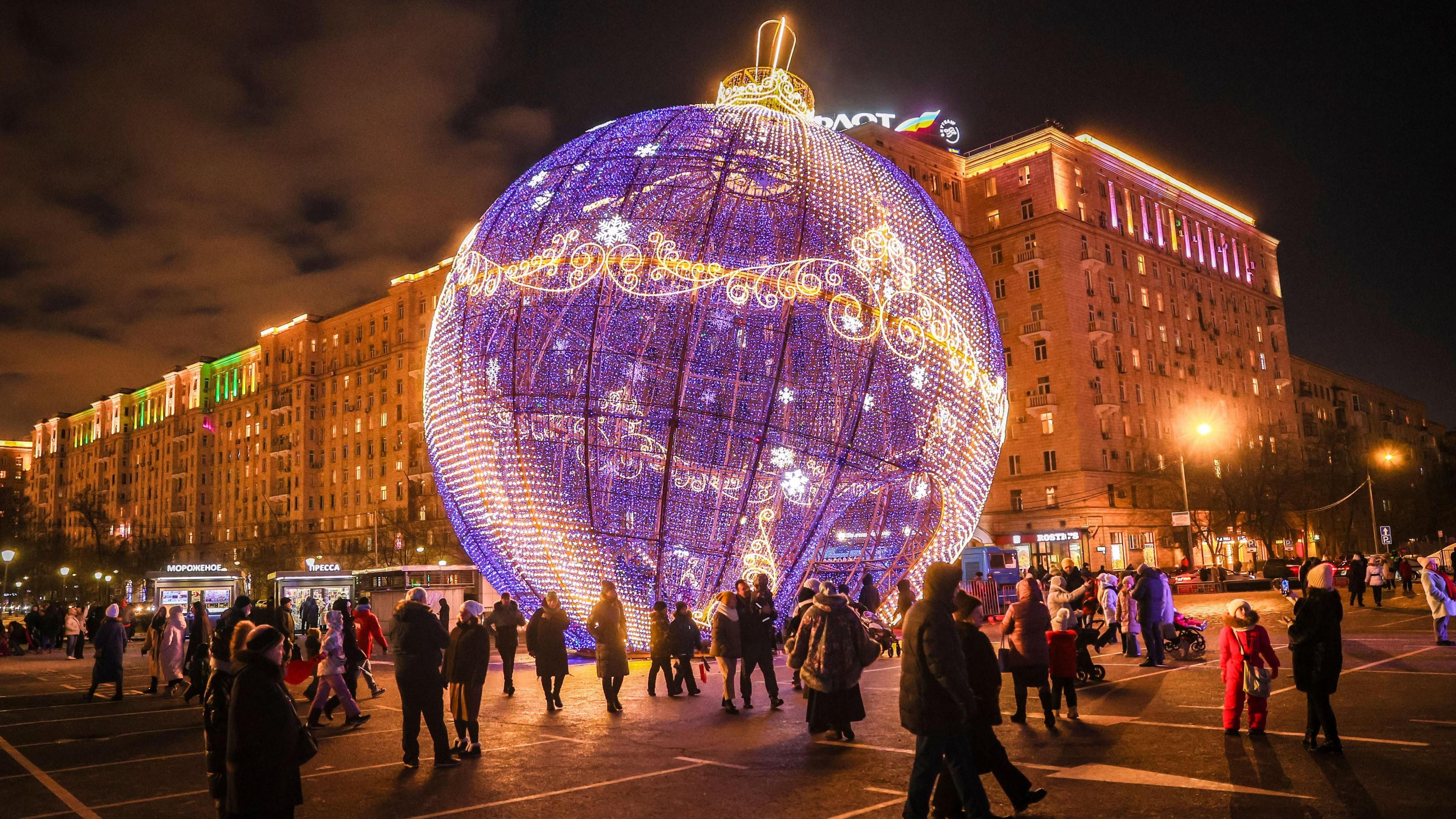 People walk past street decorations for Christmas holidays in Moscow, Russia, 06 January 2025.