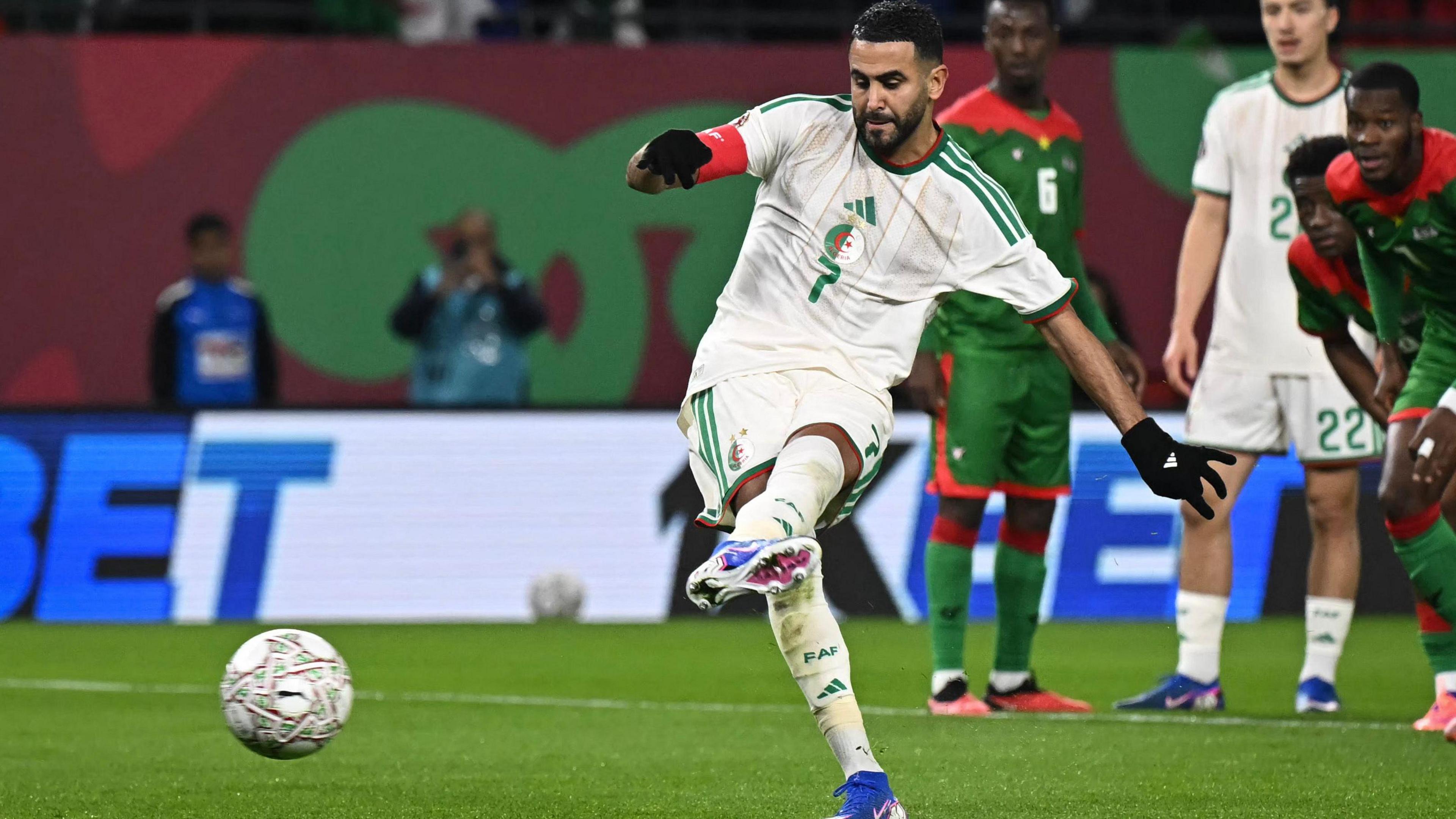 Riyad Mahrez kicks the ball with his left foot while taking a penalty for Algeria against Burkina Faso at Afcon 2025. 