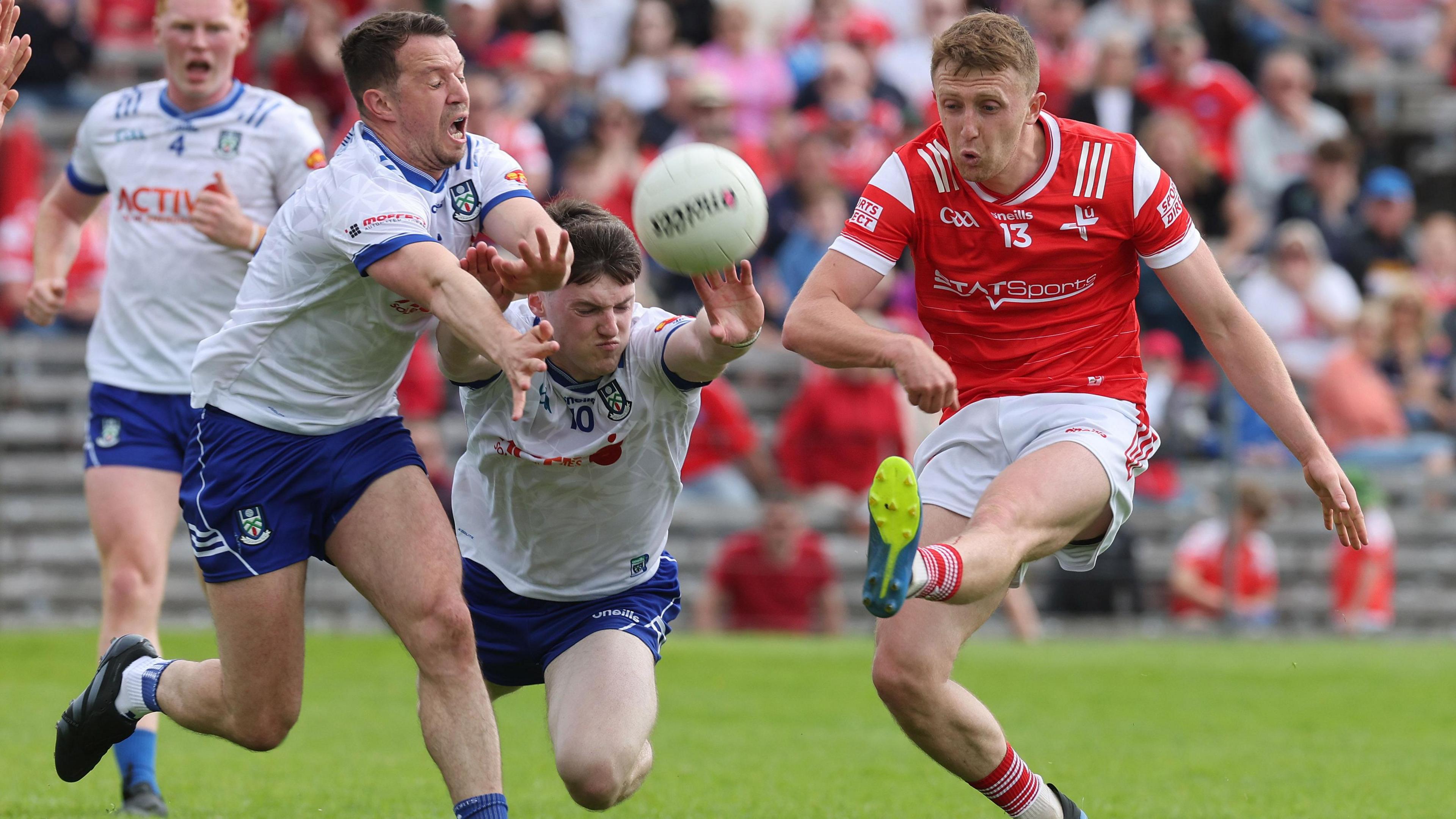 Monaghan's Ryan Wylie and Stephen O'Hanlon attempt to block a Ryan Burns kick at St Tiernach's Park