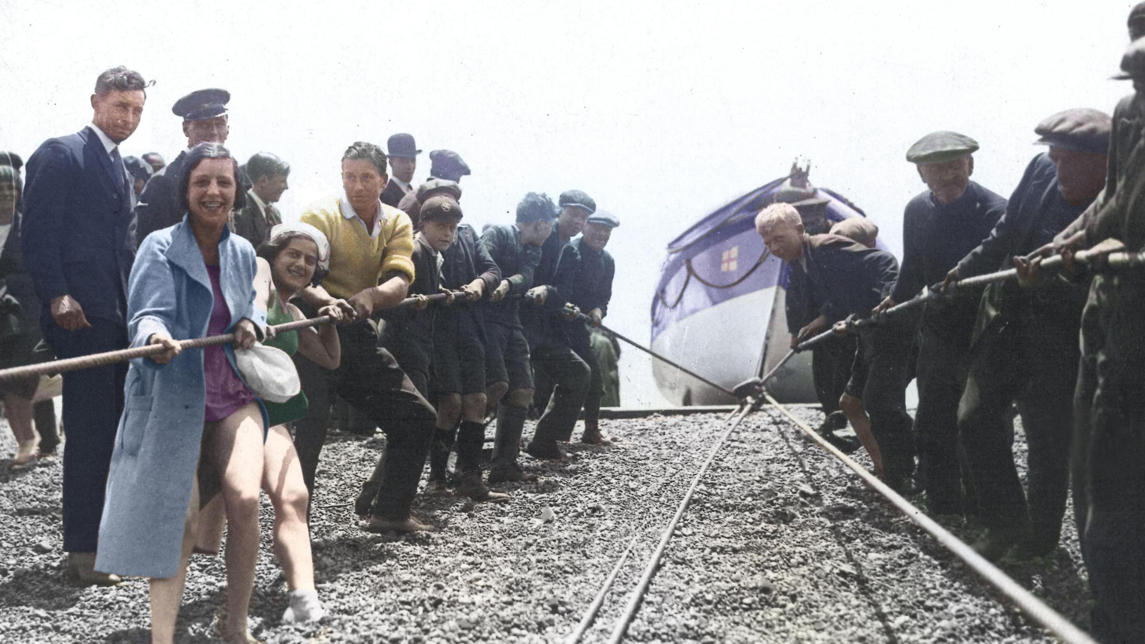 Brighton lifeboat being recovered up the beach in 1904