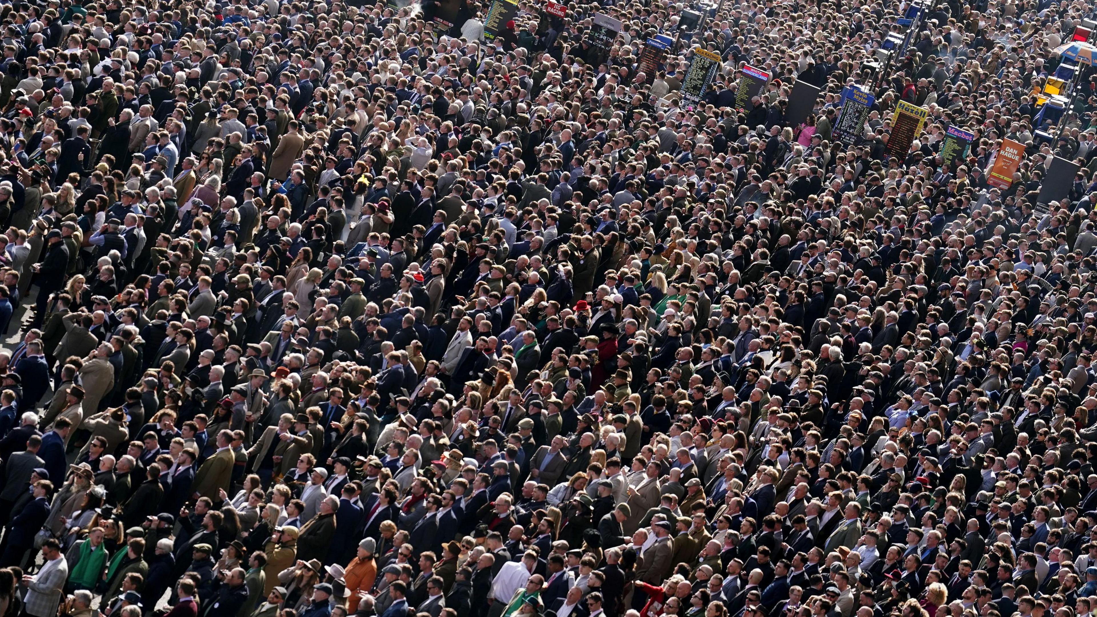 Thousands of people in a large crowd at Cheltenham Festival, taken from above