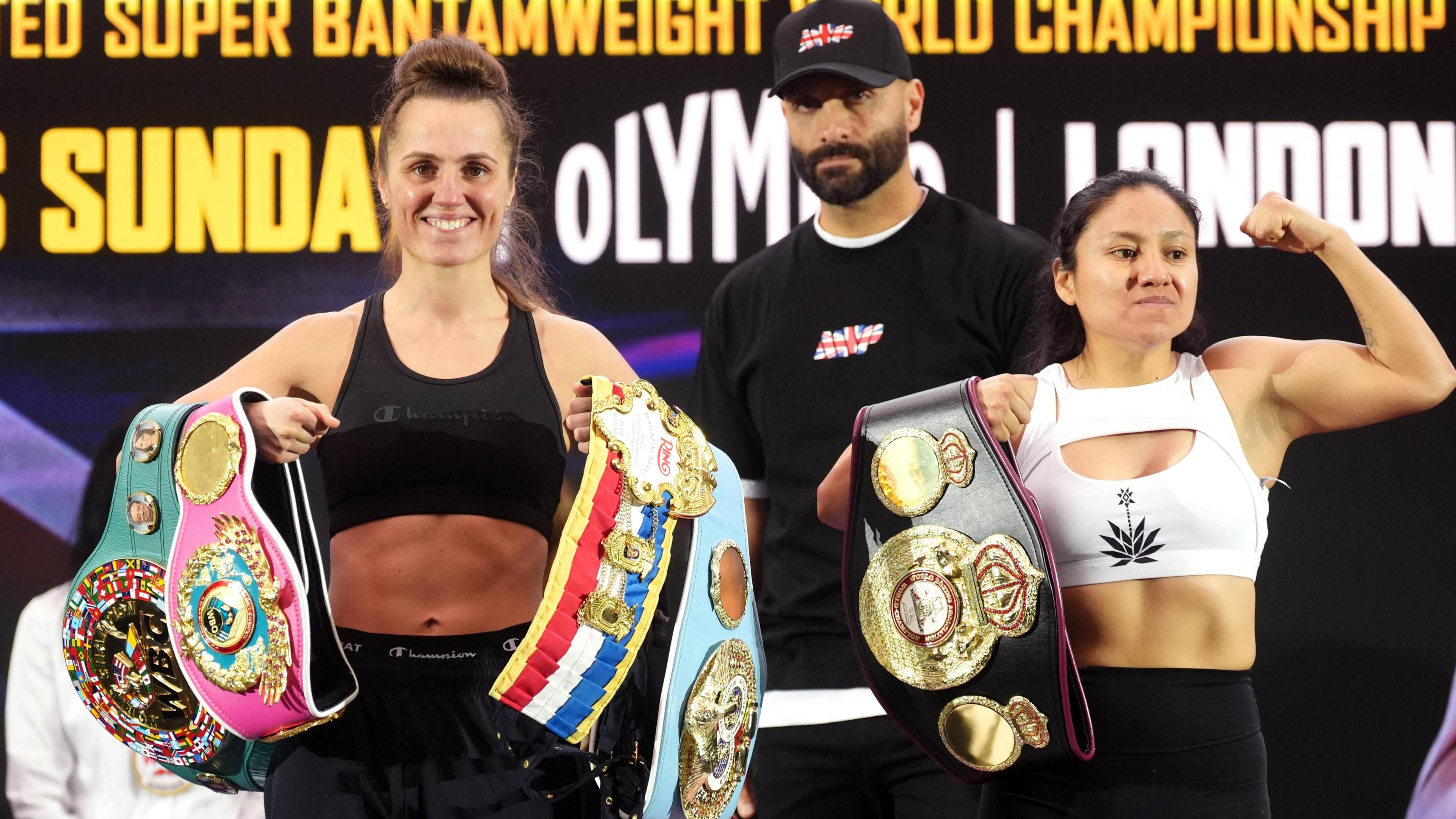 Ellie Scotney and Mayelli Flores pose with their belts