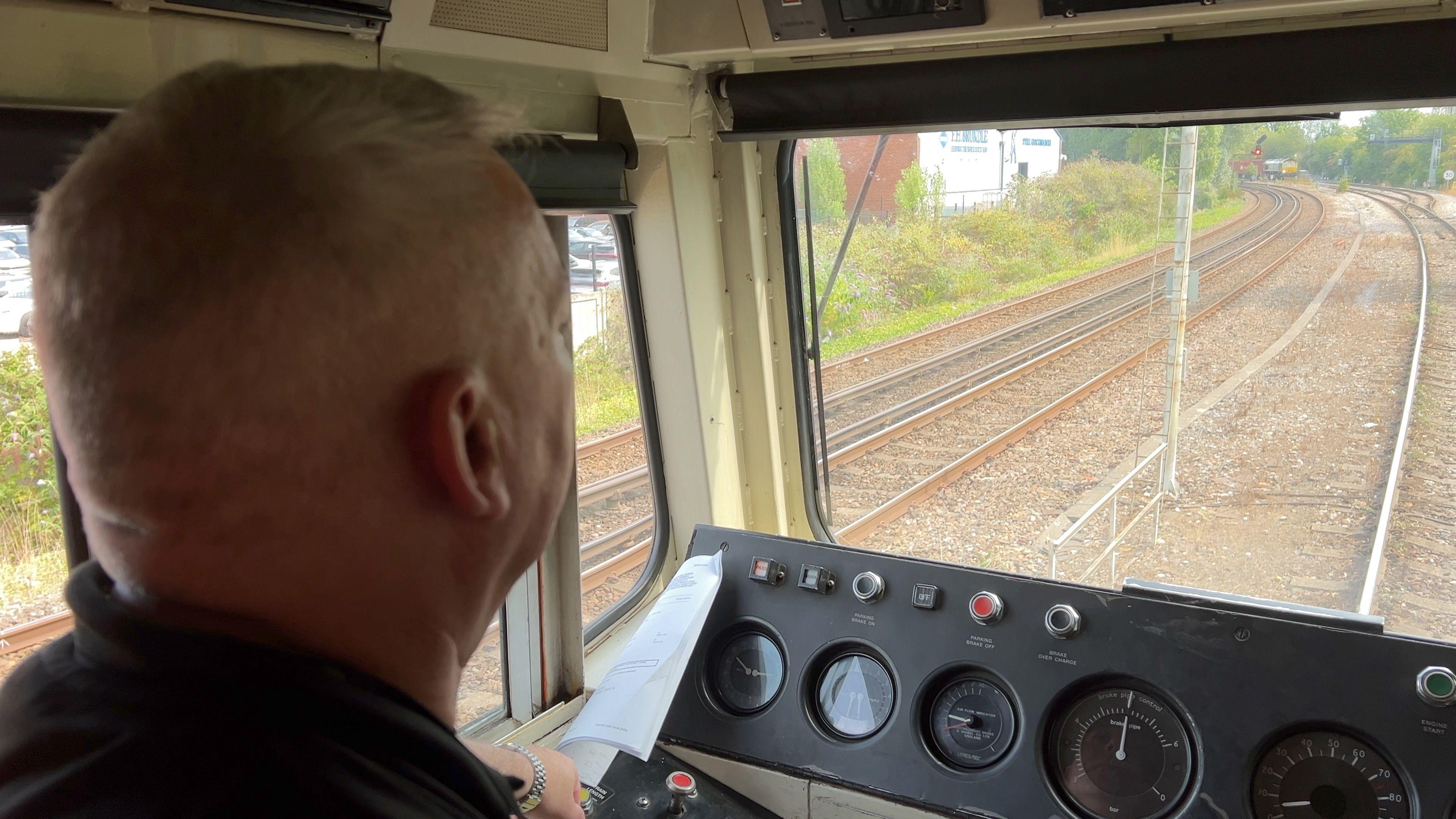 A view of the tracks ahead over the driver's shoulder from the loco cab