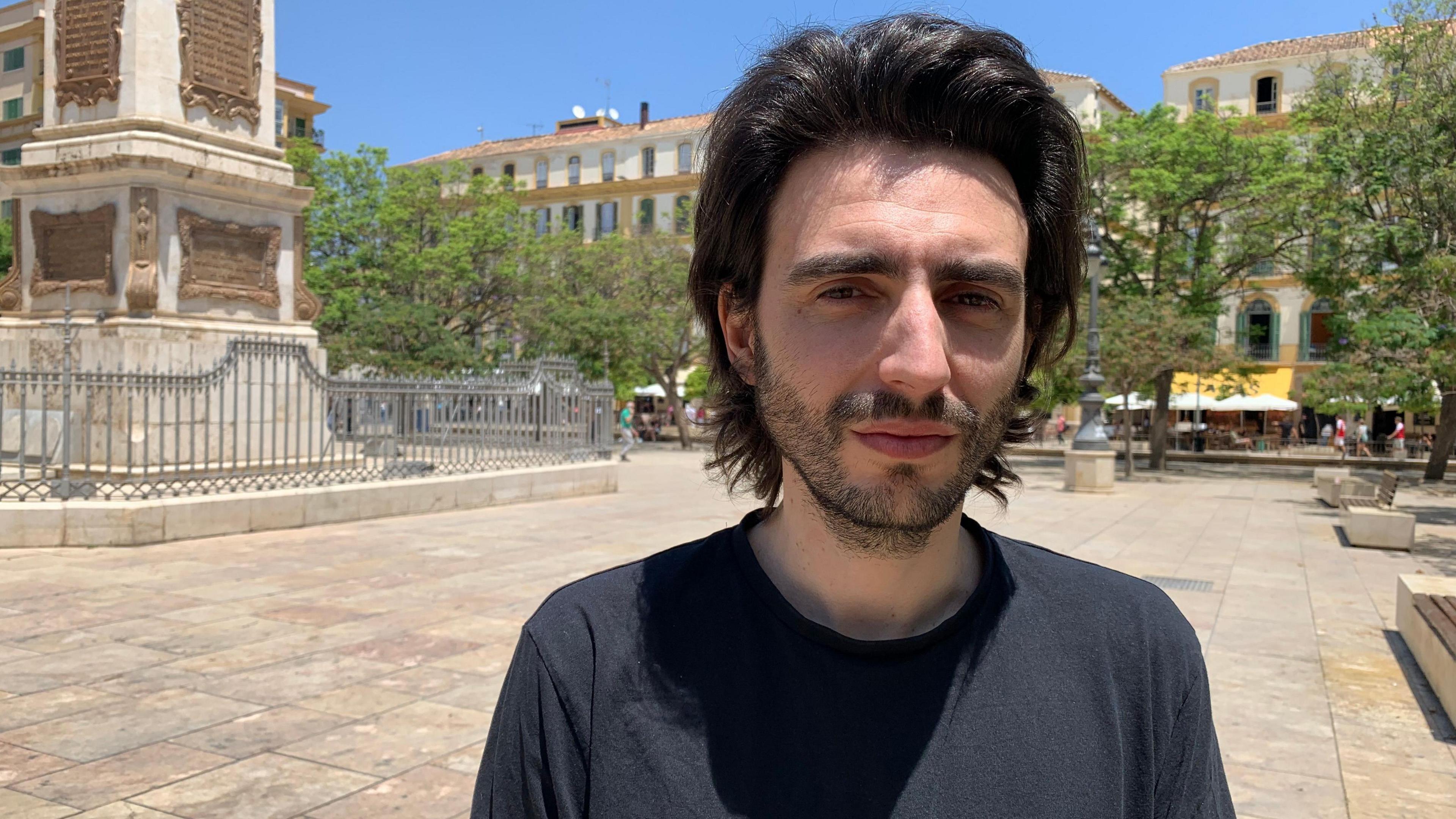 Kike España stands in Málaga's Plaza de la Merced