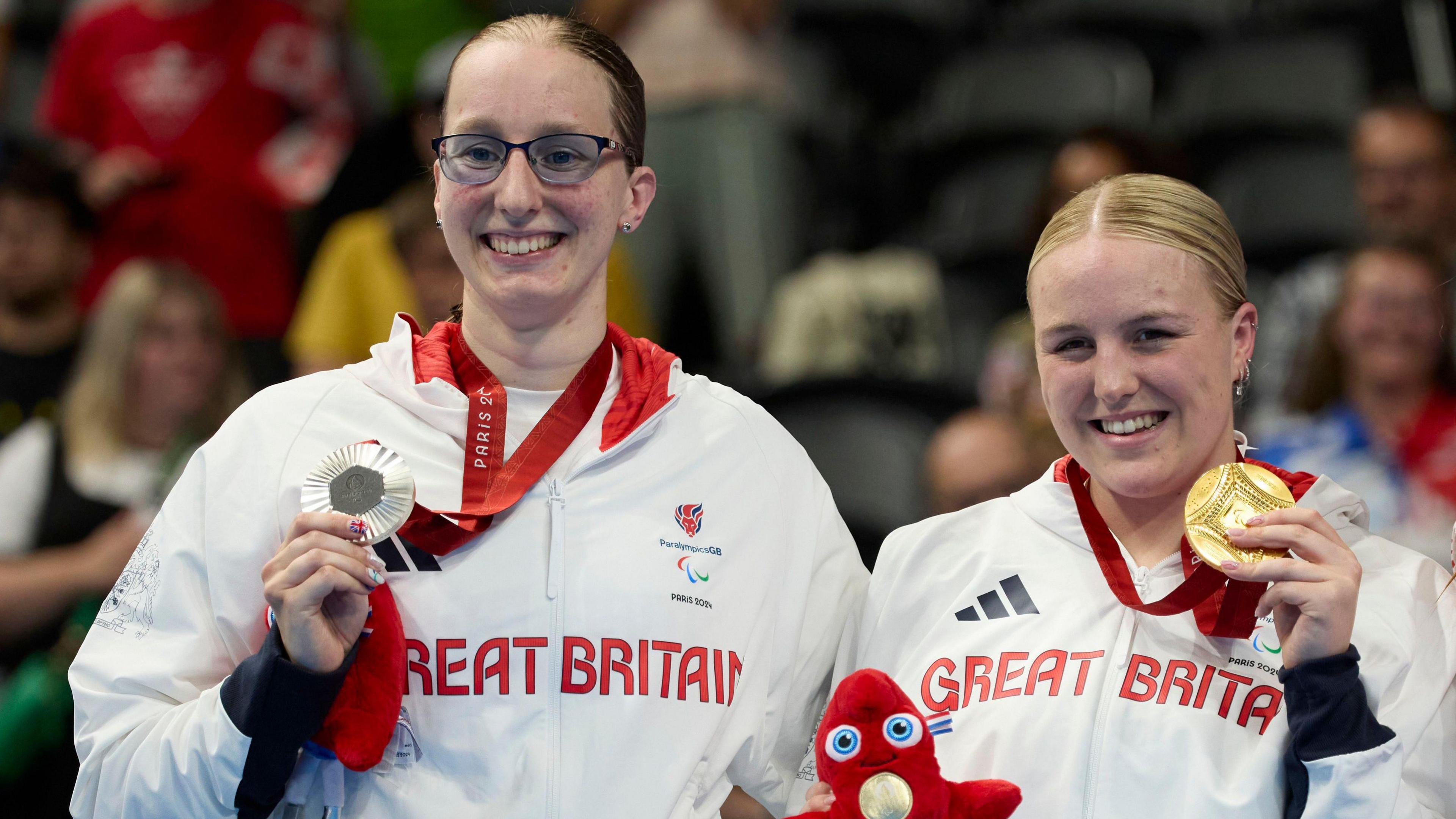 Faye Rogers and team-mate Callie-Ann Warrington on the podium holding their medals