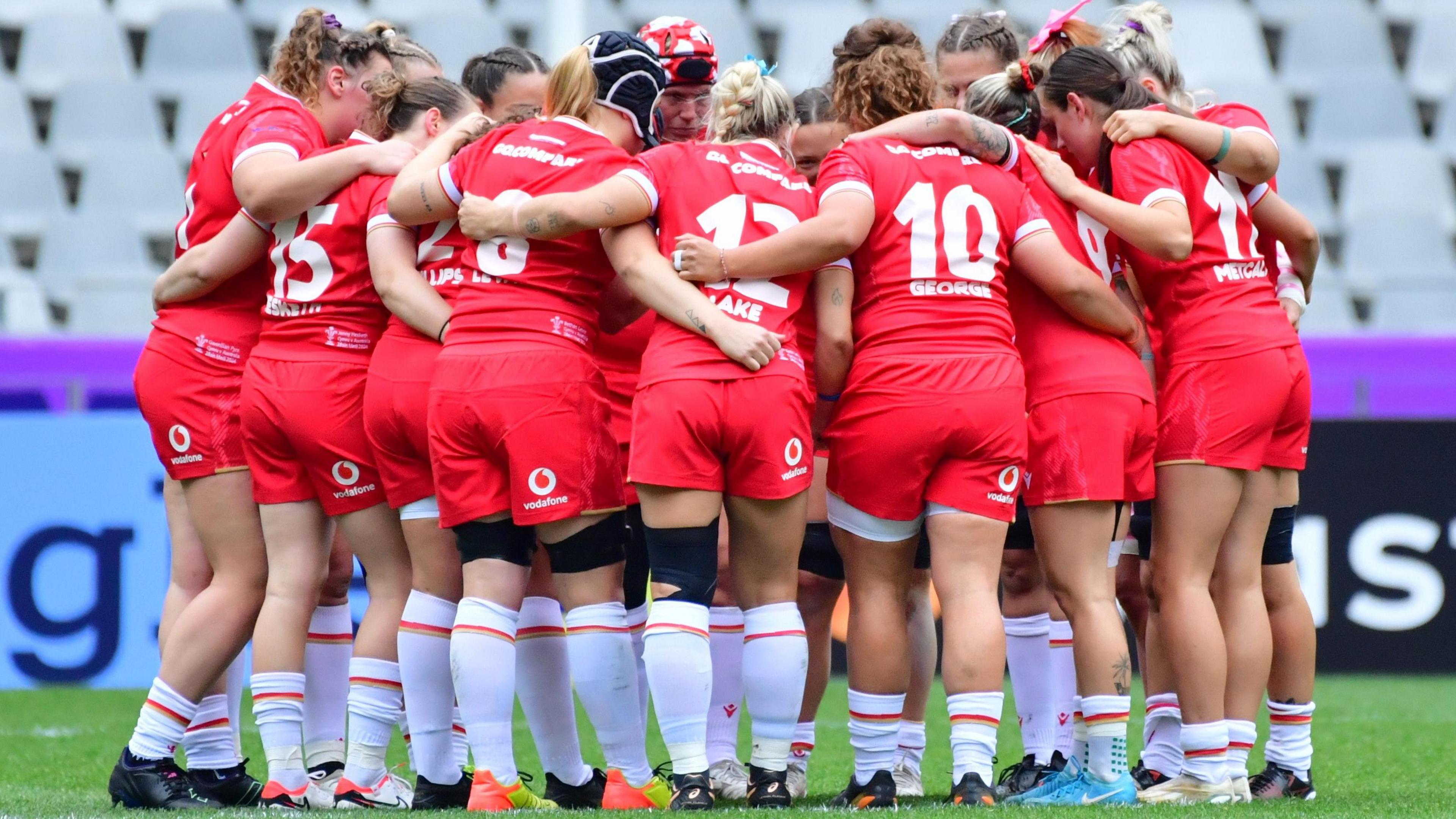 Wales women in a huddle before a game