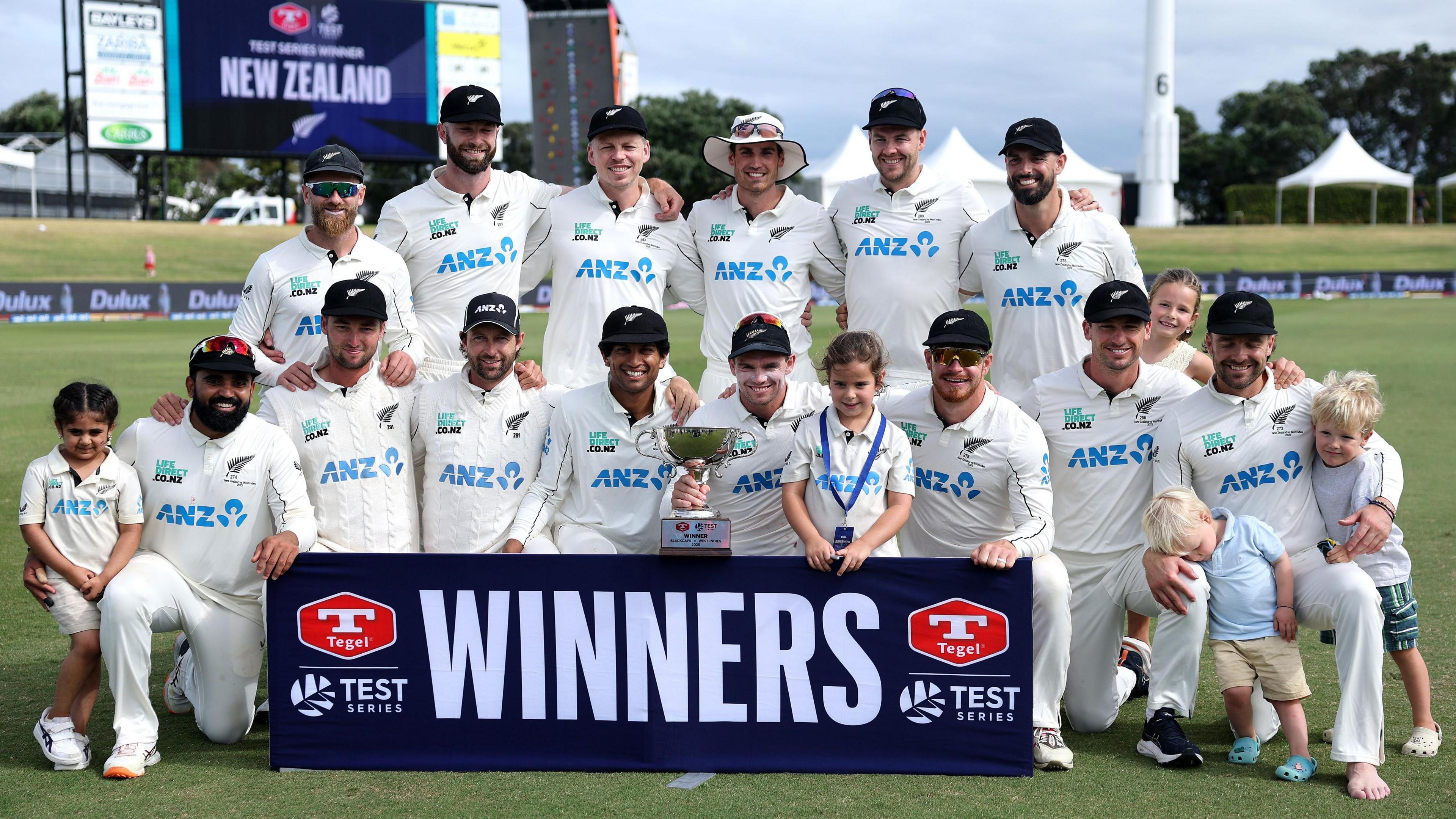 New Zealand (and some of the players' children) with the Test series trophy