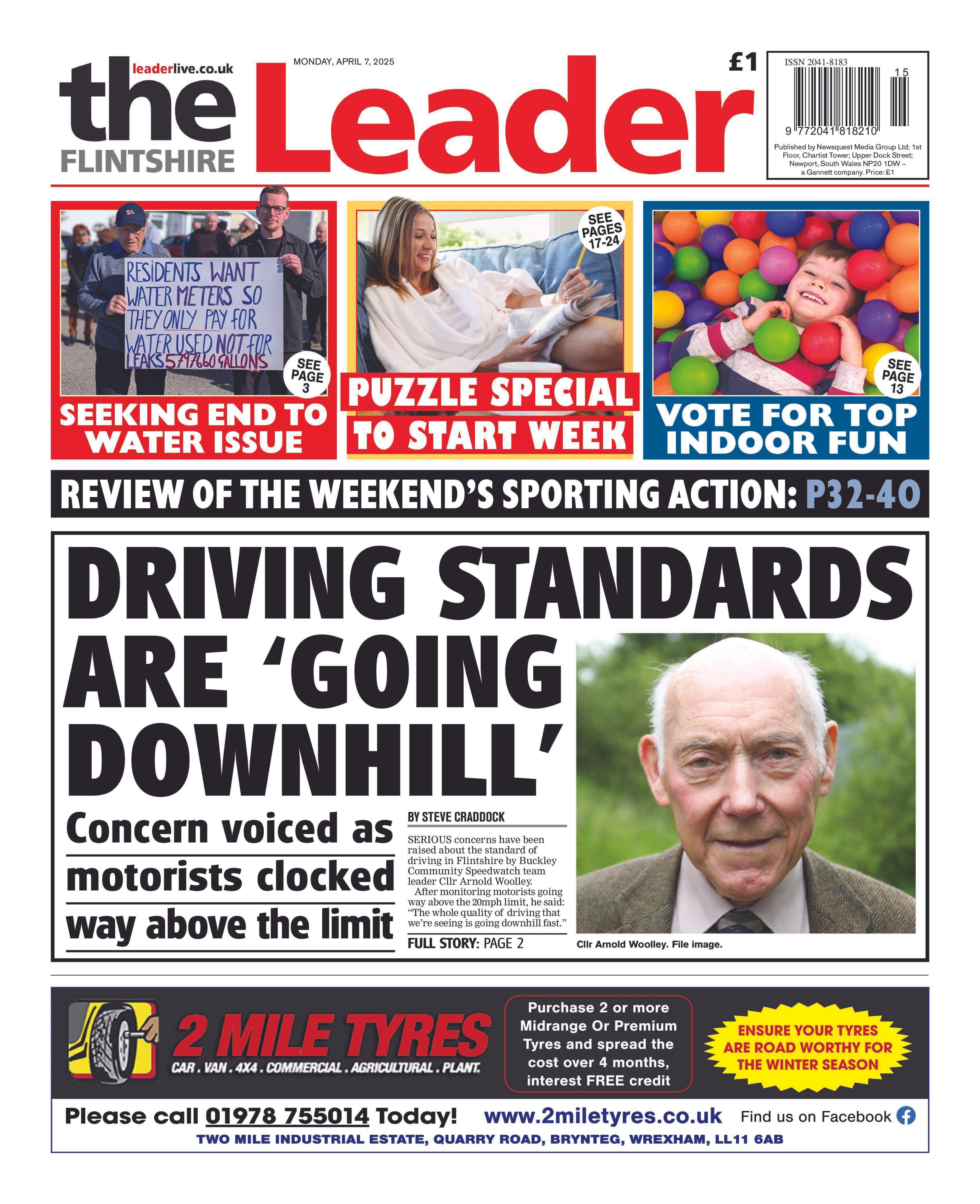 Front page of the Flintshire Leader with the splash headline "Driving standards are 'going downhill'" and a picture of a bald man. At the bottom of the page is an advertisement for 2 Mile Tyres and at the top are three boxes. The left box has a picture of two men holding up a poster and the headline "seeking end to water issue". The middle box has a picture of a woman and the headline "puzzle special to start week". The right box has a picture of a young boy lying in a colourful ball pit and the headline "vote for top indoor fun".