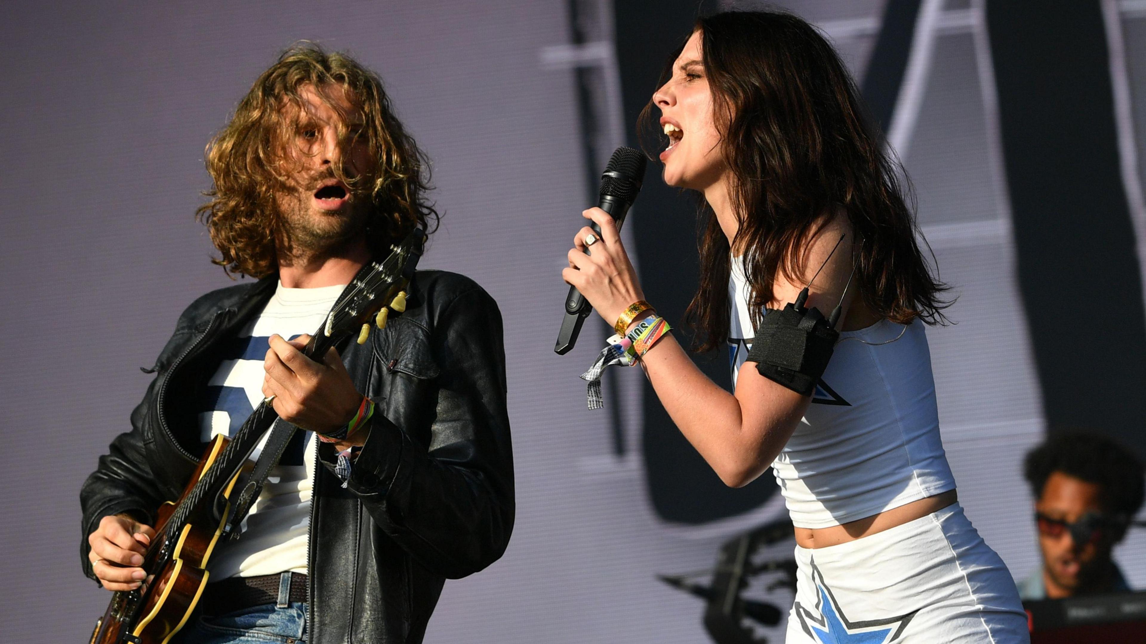 Ellie Rowsell singing and Joff Oddie playing the guitar on stage