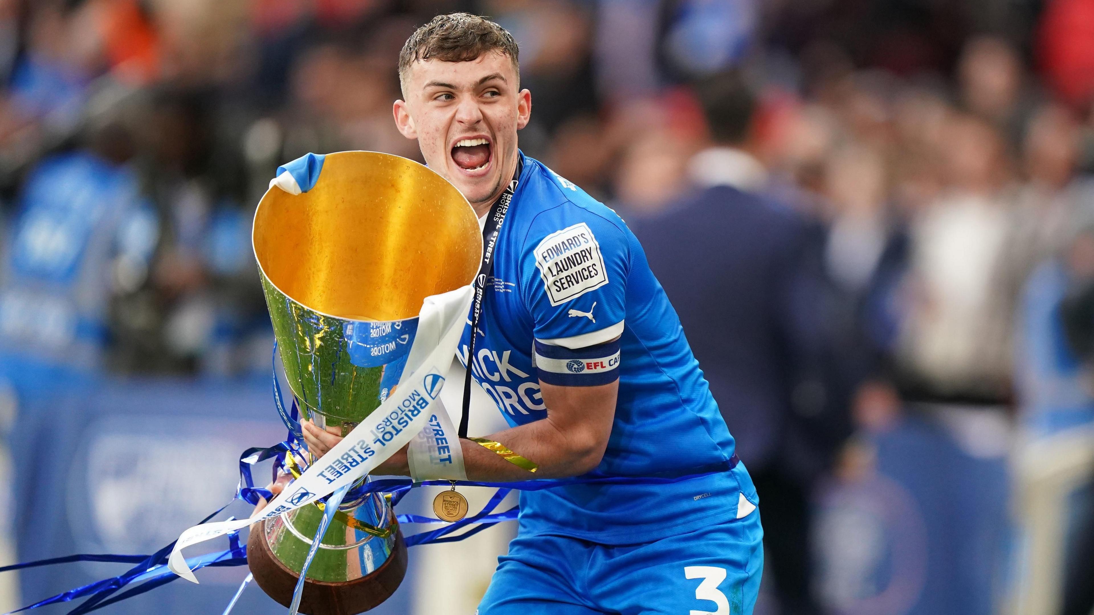 Harrison Burrows holding the cup