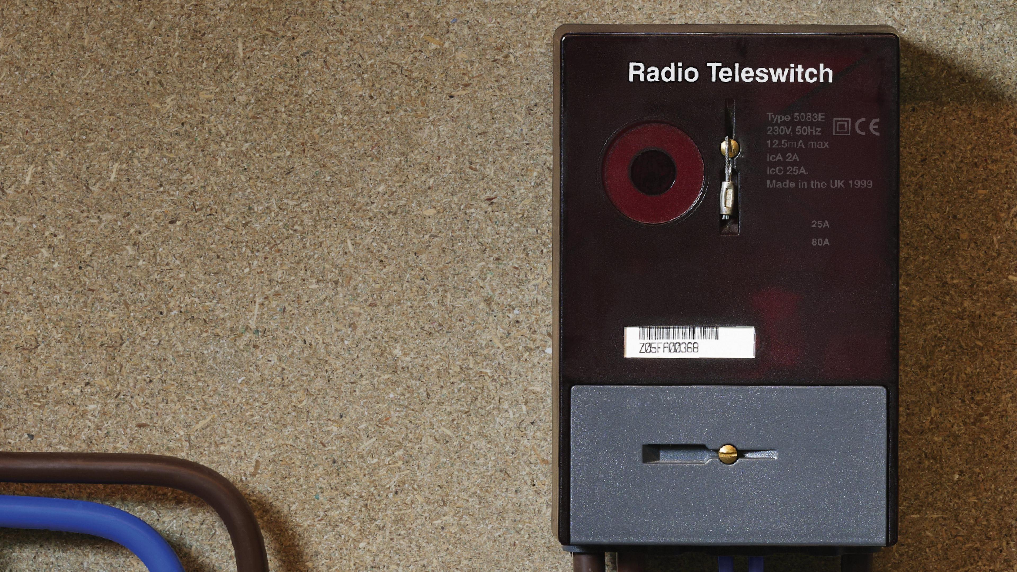 A black Radio Teleswitching System (RTS) box on a board