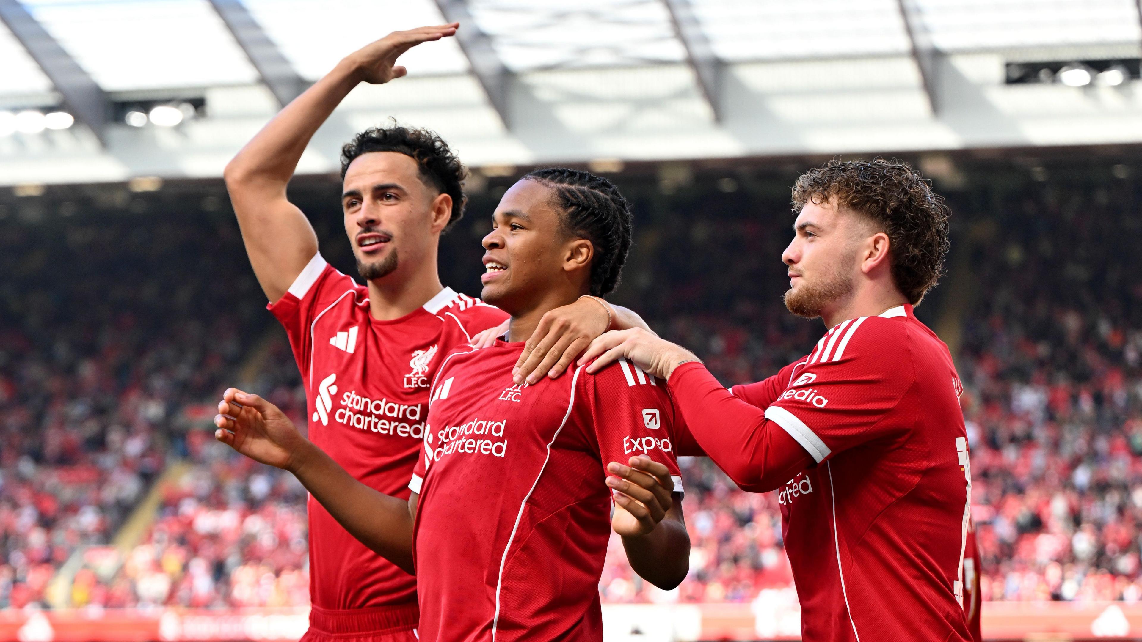 Liverpool's Rio Ngumoha celebrates with Harvey Elliott and Curtis Jones after scoring at Anfield.