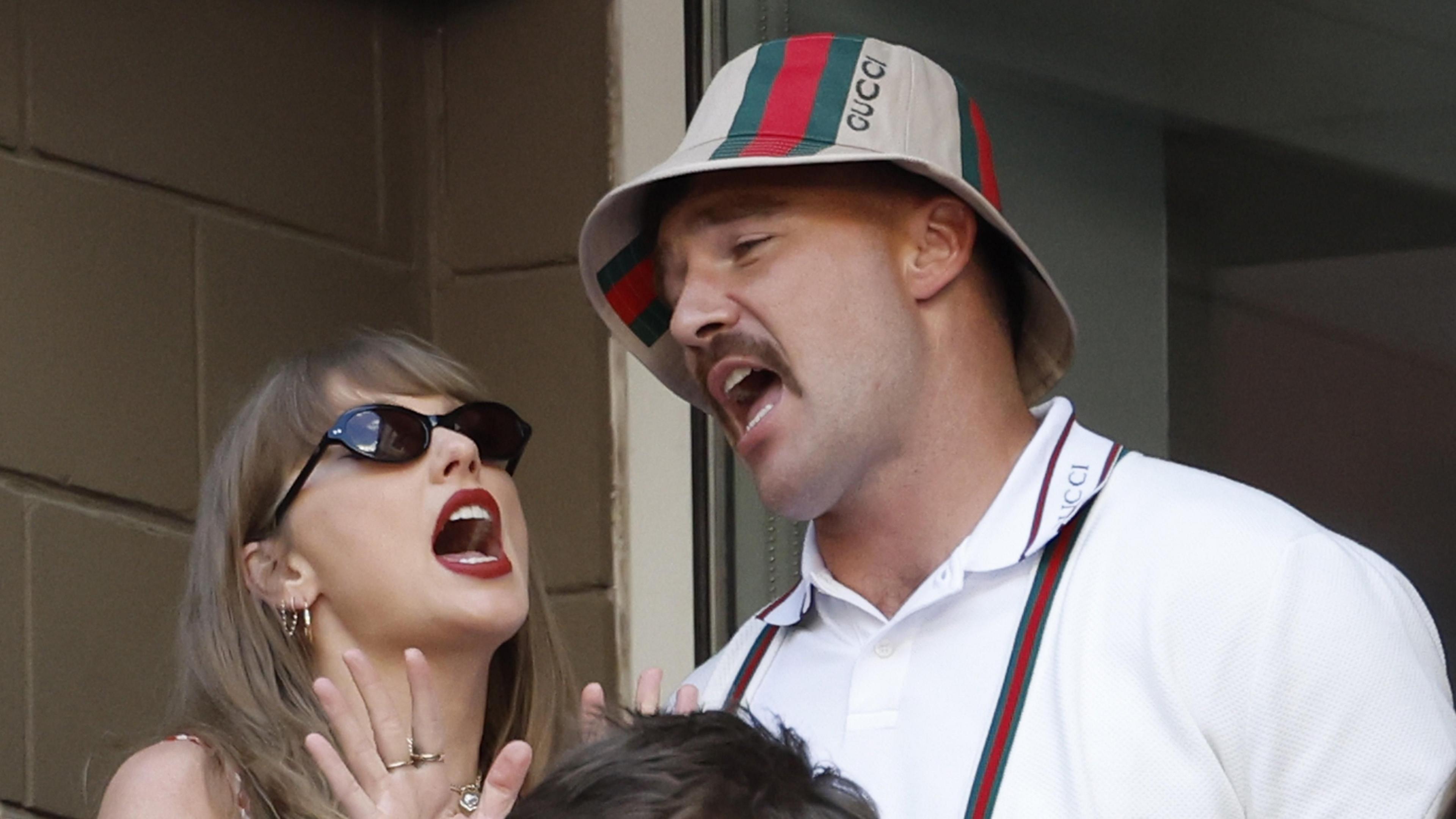 Taylor Swift and Travis Kelce appear to sing with Kelce wearing a Gucci hat