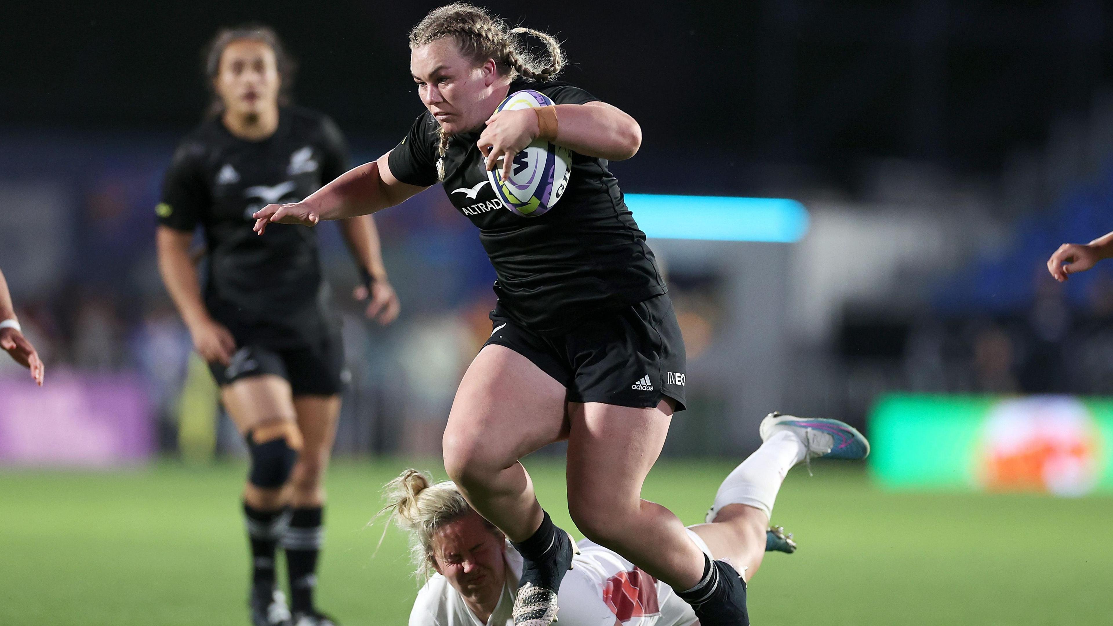 Amy Rule carrying the ball while playing for New Zealand