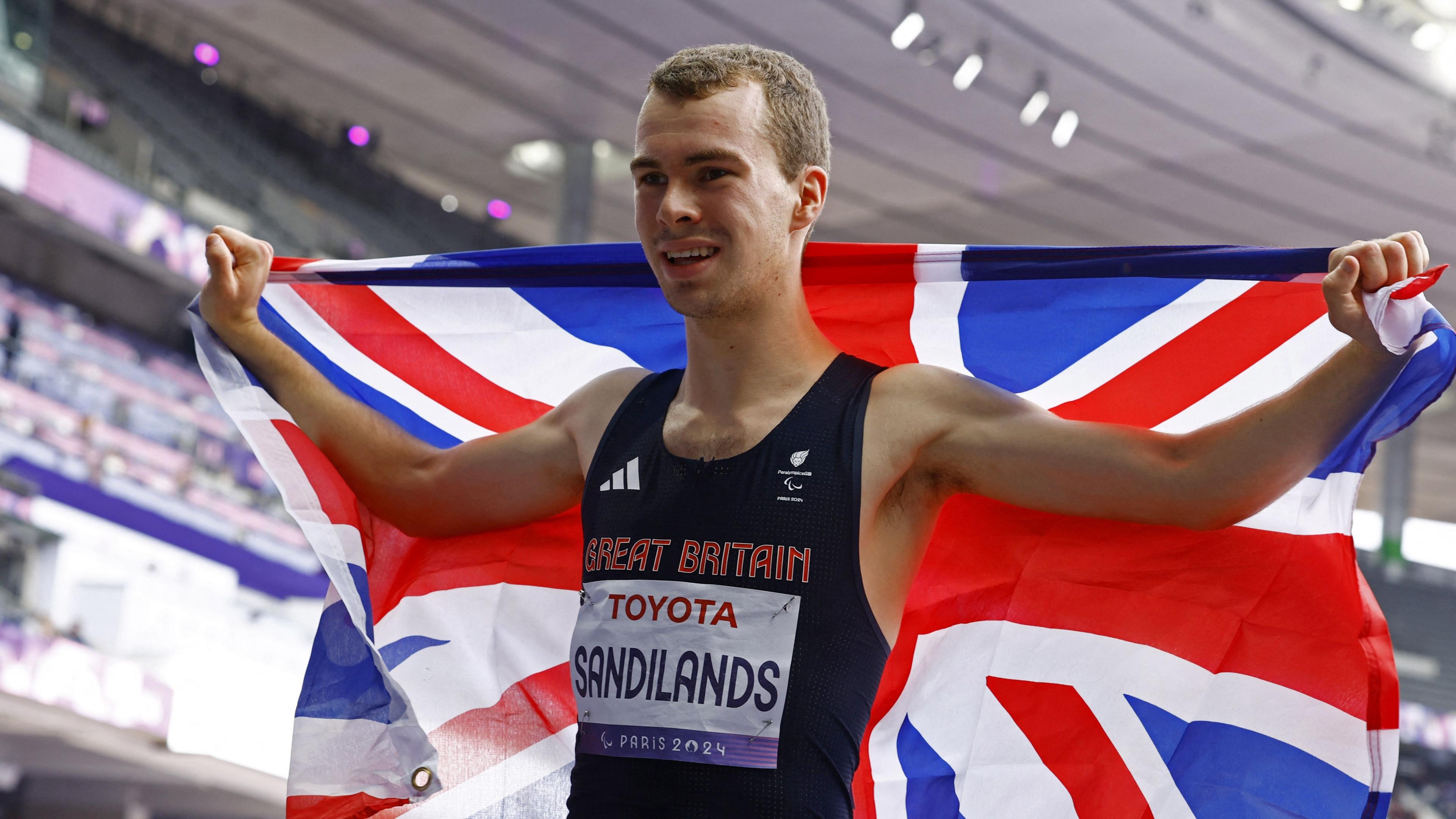 Ben Sandilands celebrates with a Great Britain flag