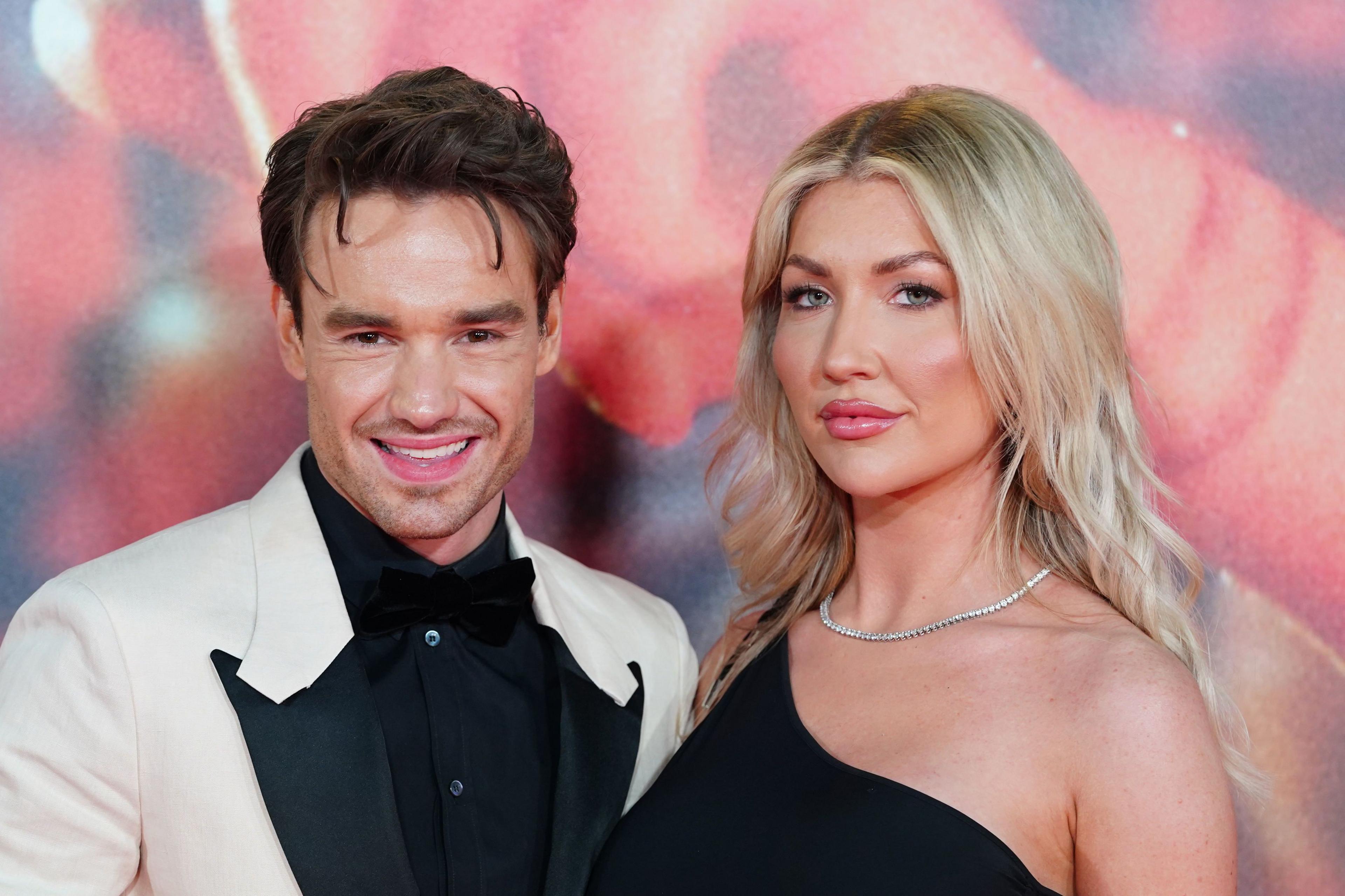 Liam Payne and Kate Cassidy standing together facing the camera