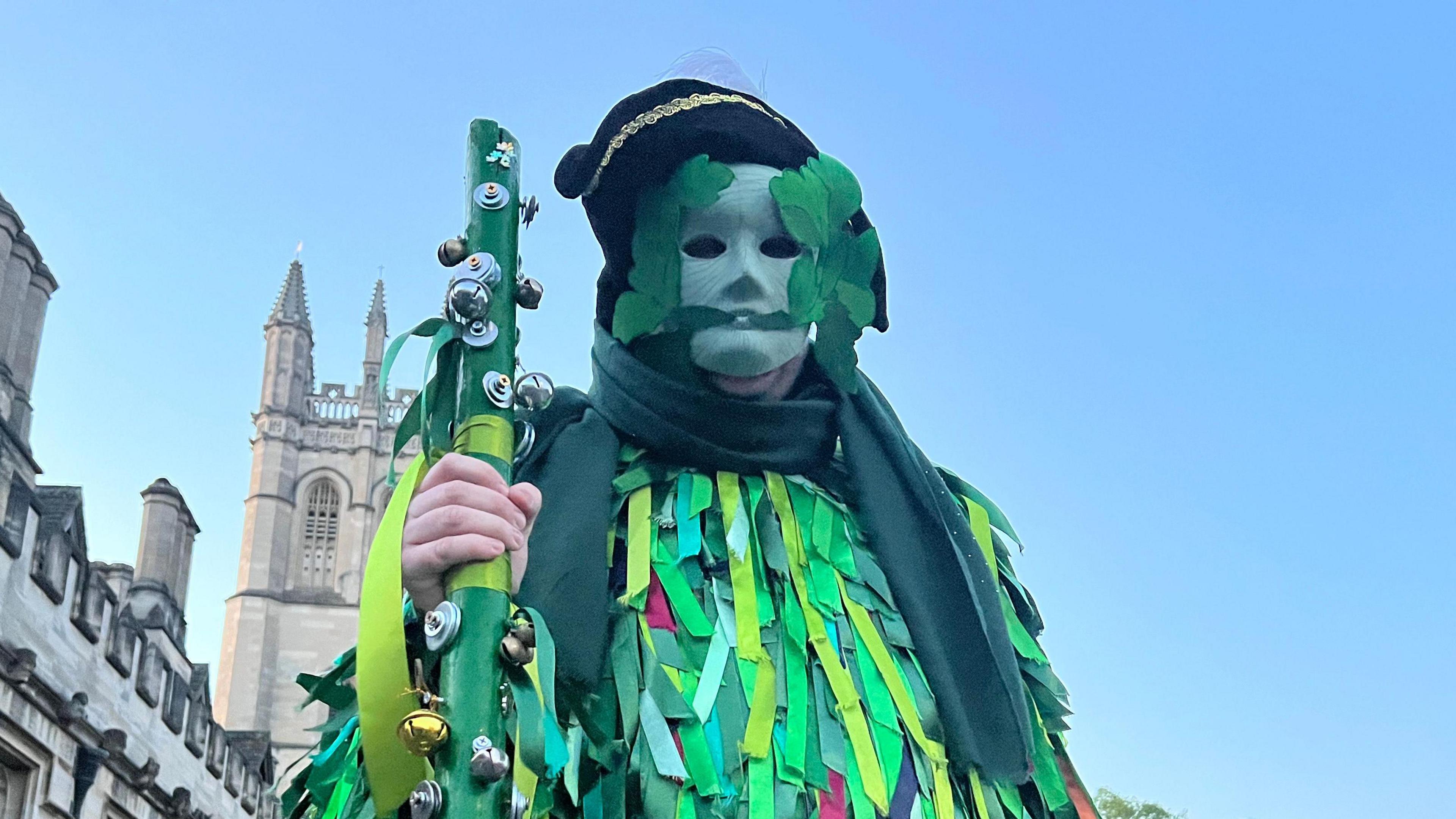A person dressed in green man costume in Oxford