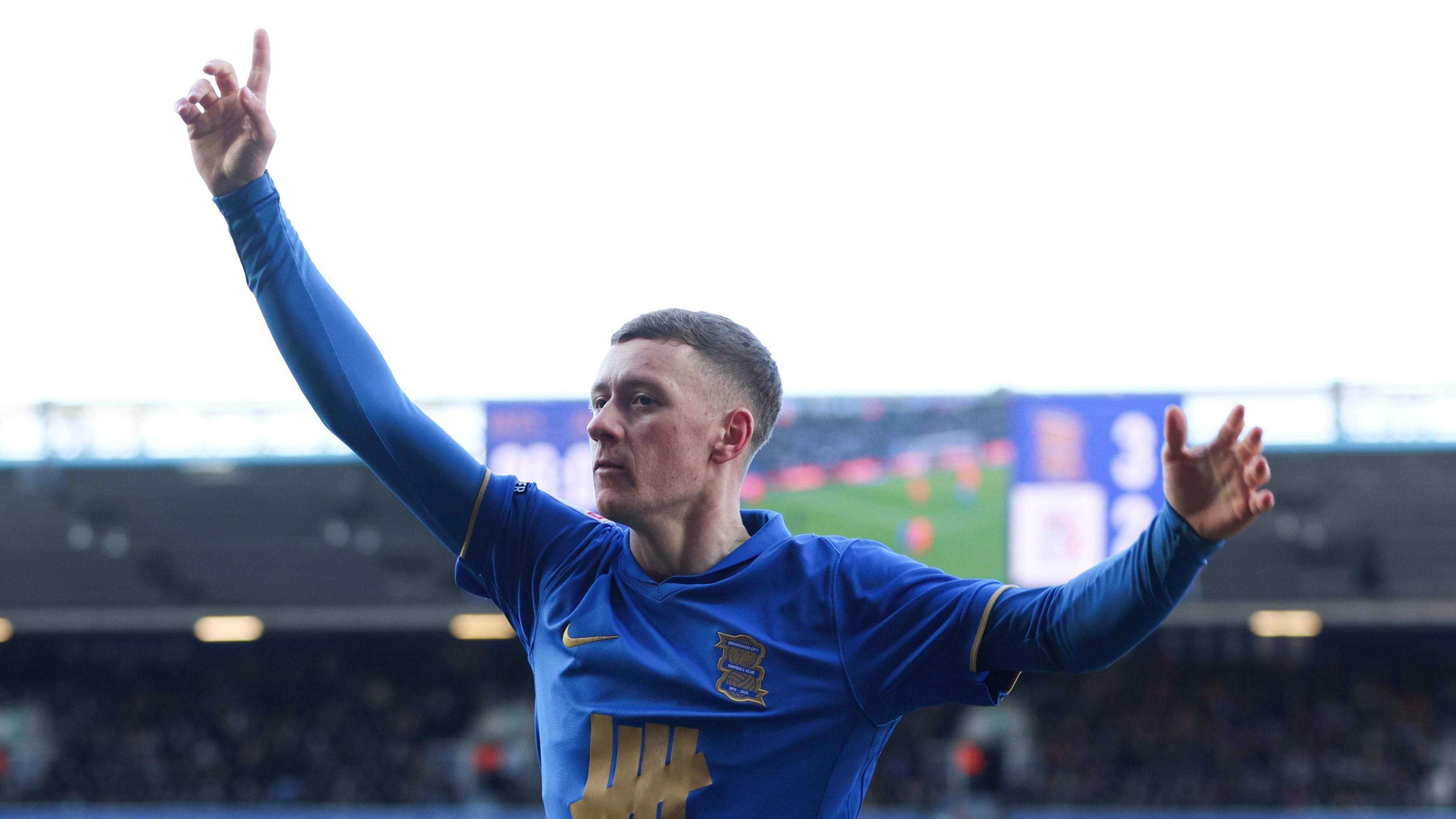 Birmingham City's Jay Stansfield with his arms raised