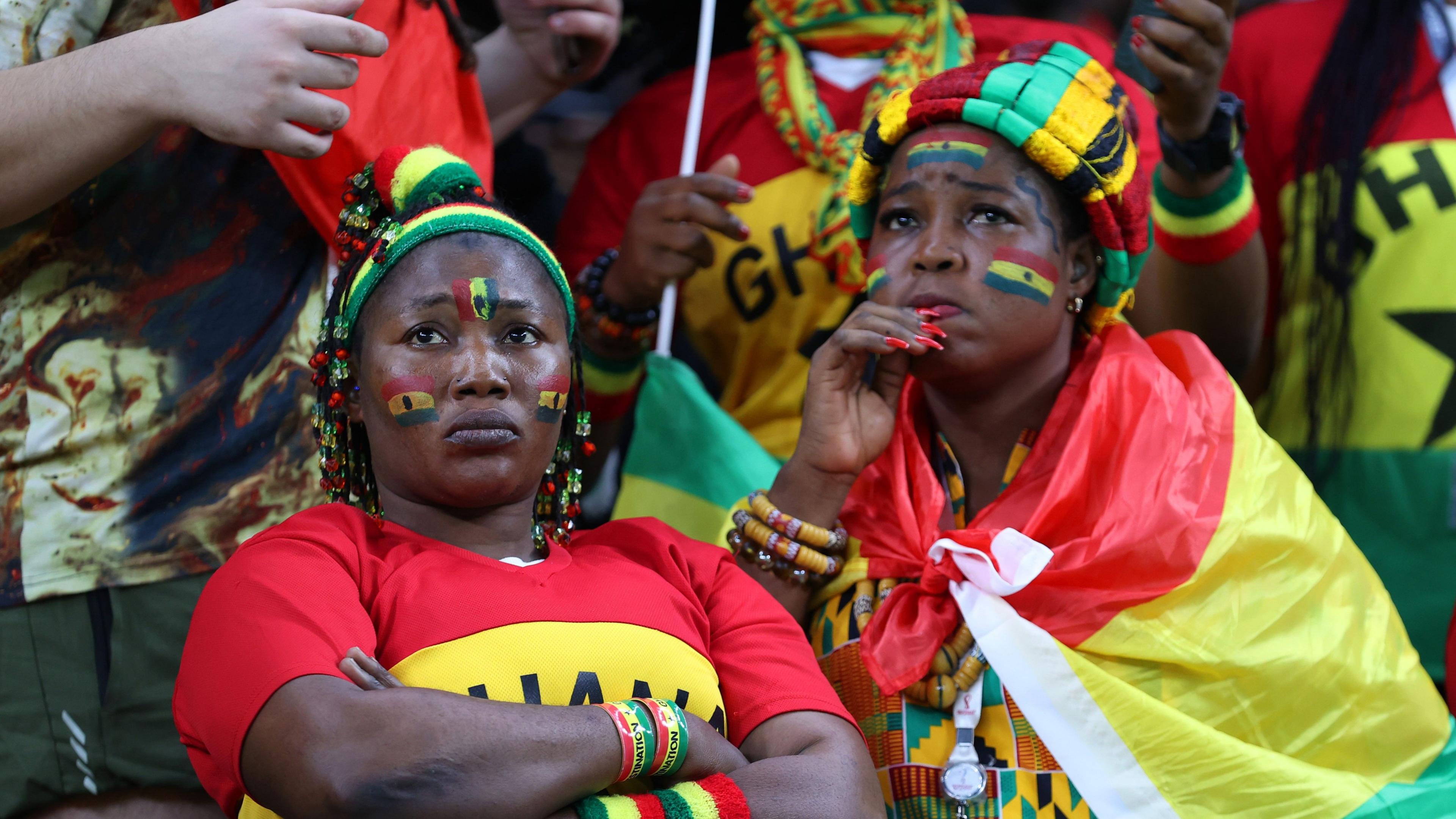 Two Ghana fans watch a World Cup match