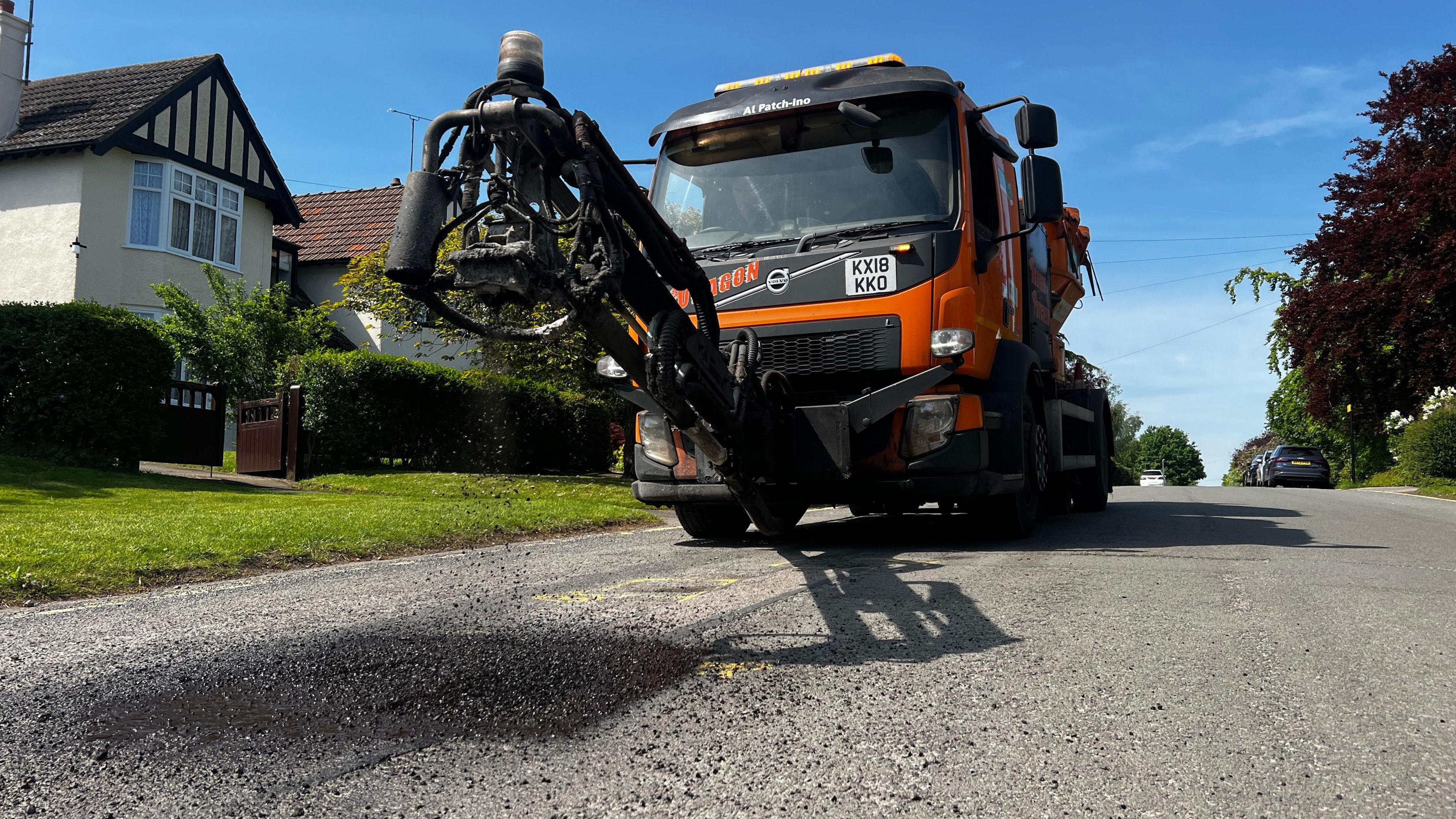 A Dragon Patcher filling potholes in A Cambridgeshire village