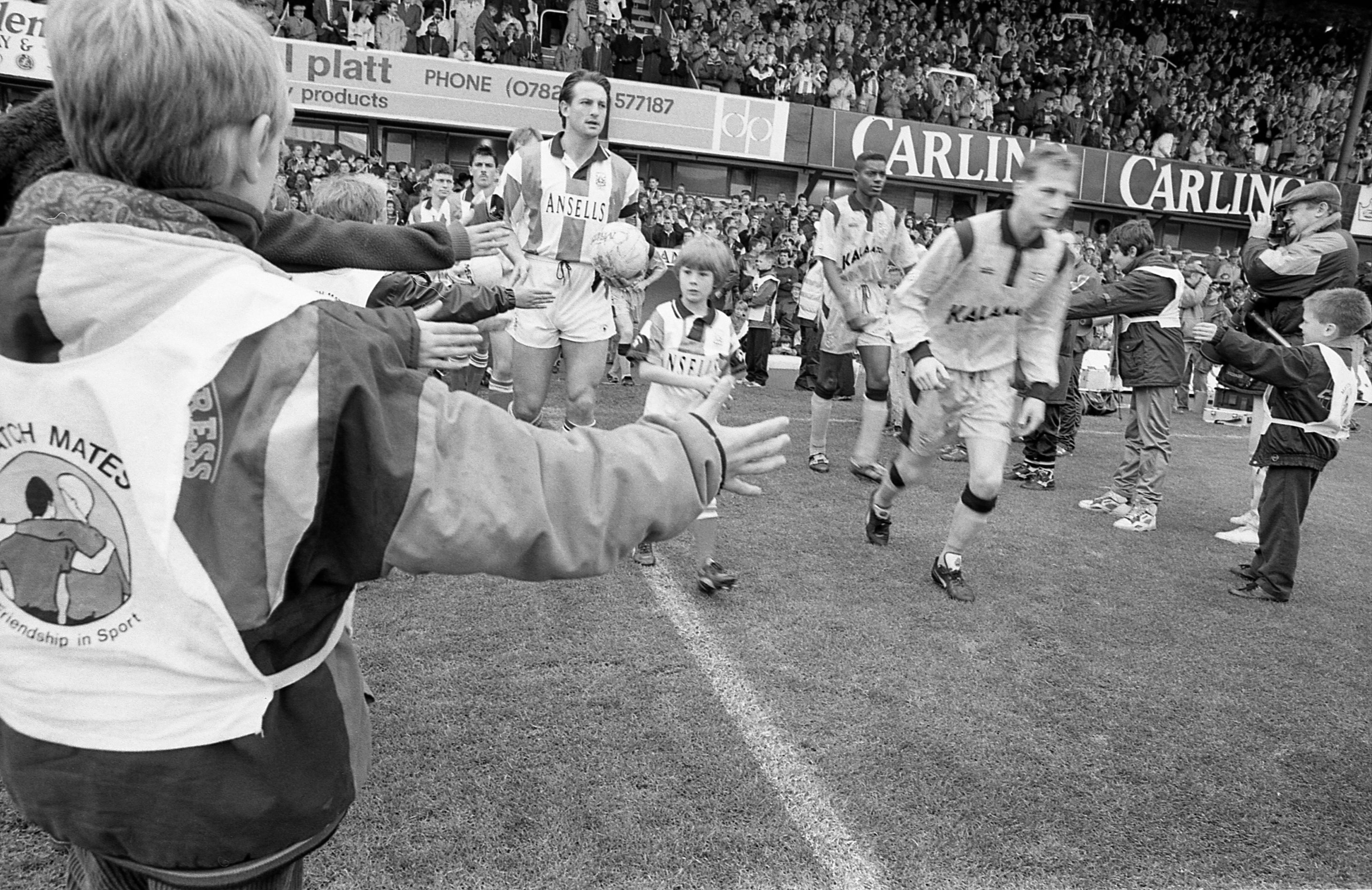 Players coming onto the Victoria Ground pitch