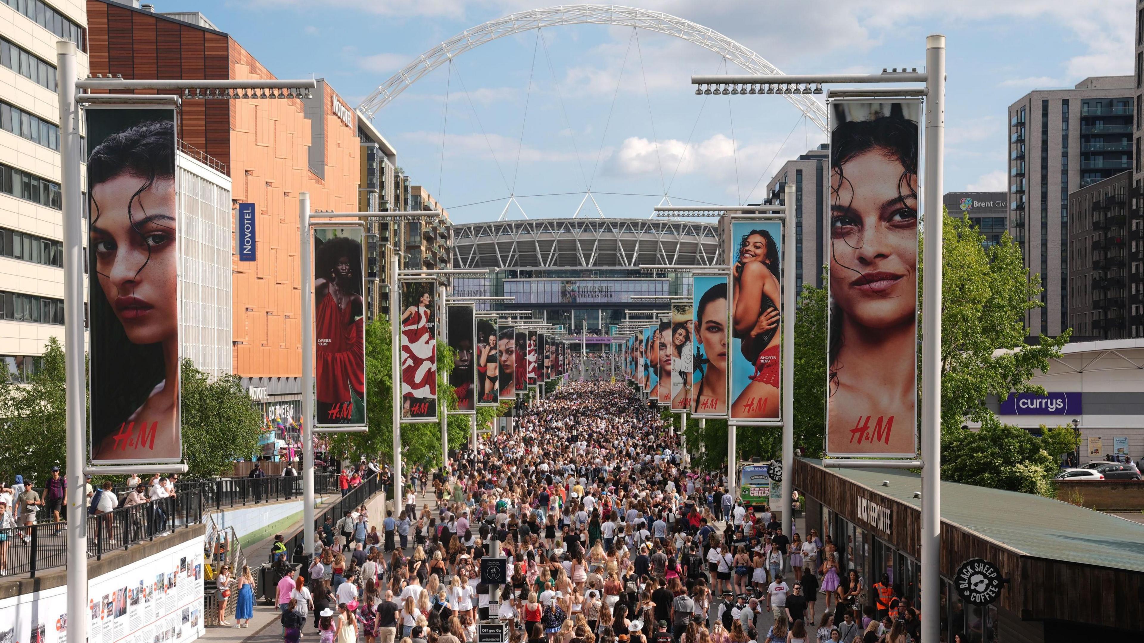 An aerial shot of a huge crowd outside Wembley Stadium