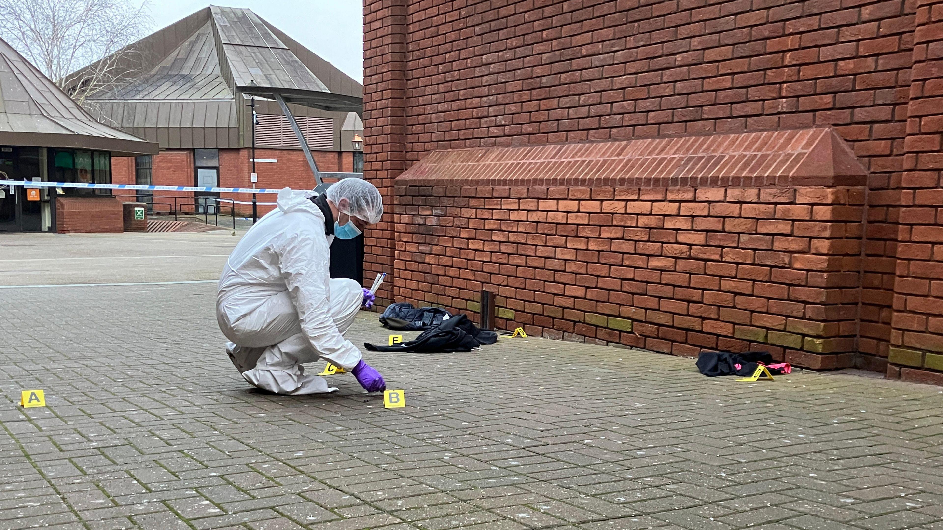 Forensic officers working at the scene