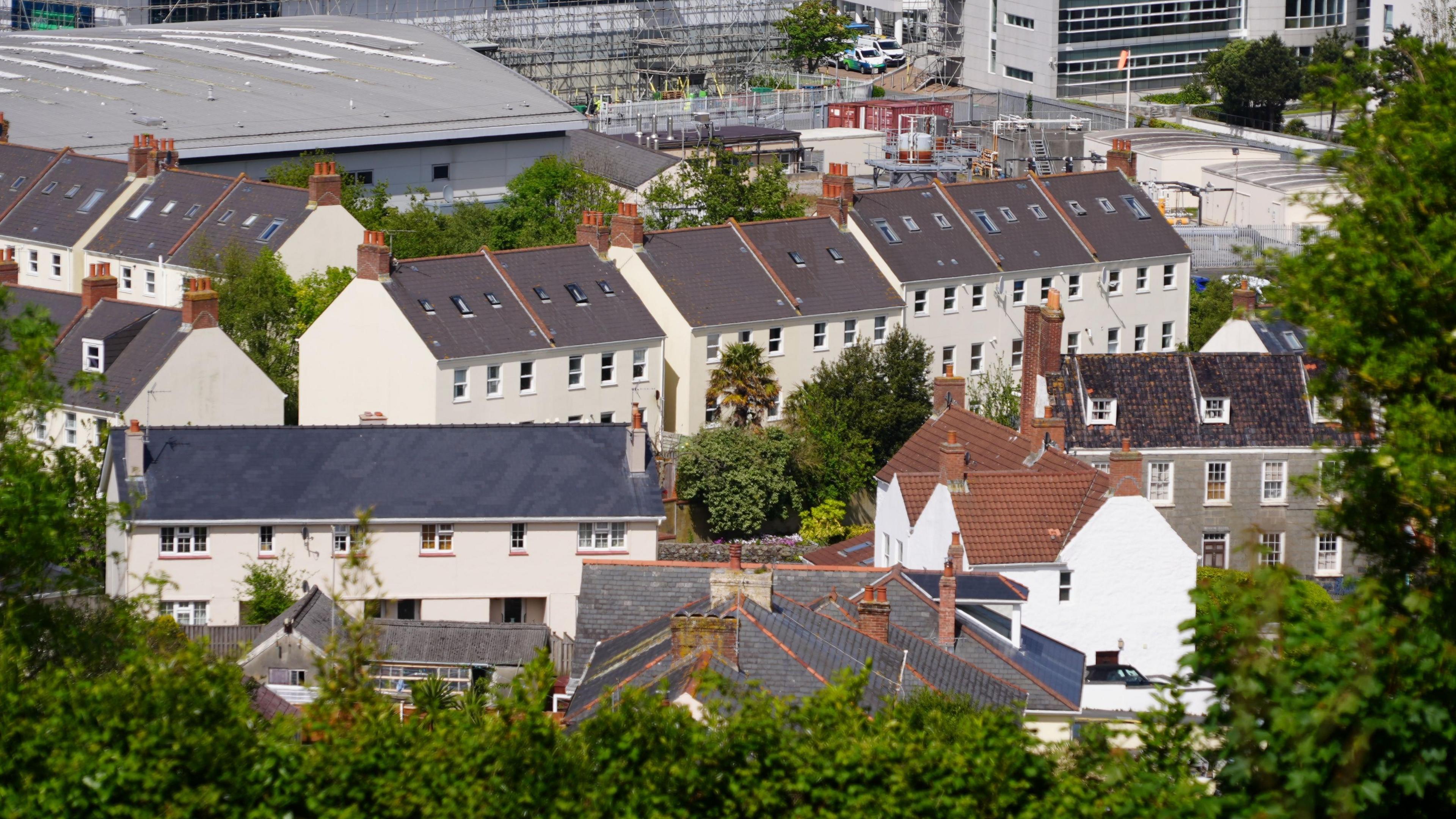 A picture from a high point looking across a number of rooftops in Guernsey 