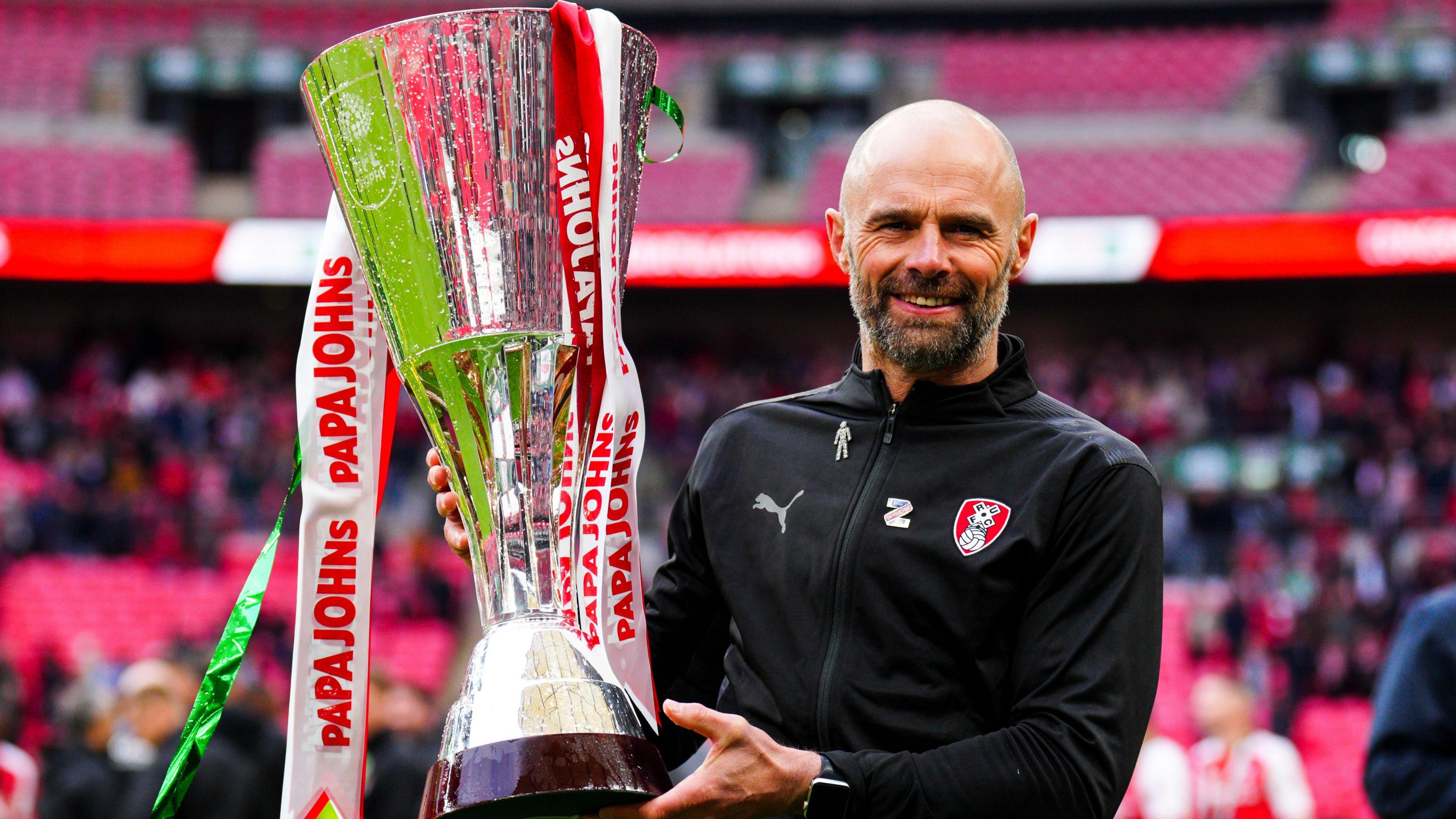 Paul Warne holding the EFL Trophy after the 2022 final