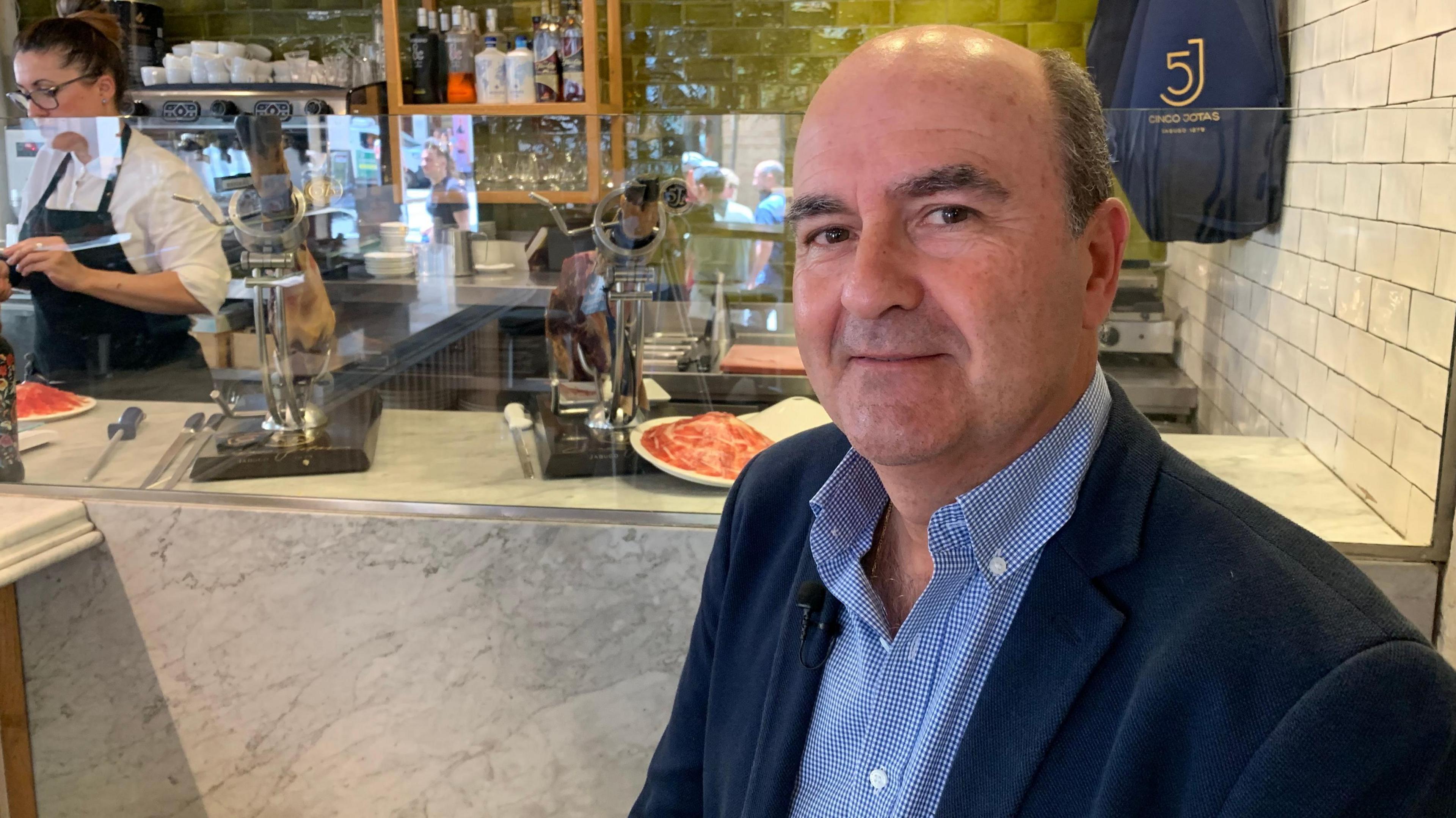 Jaime Fernández, international commercial director for the Spanish food firm Grupo Osborne, sitting in a bar in Seville