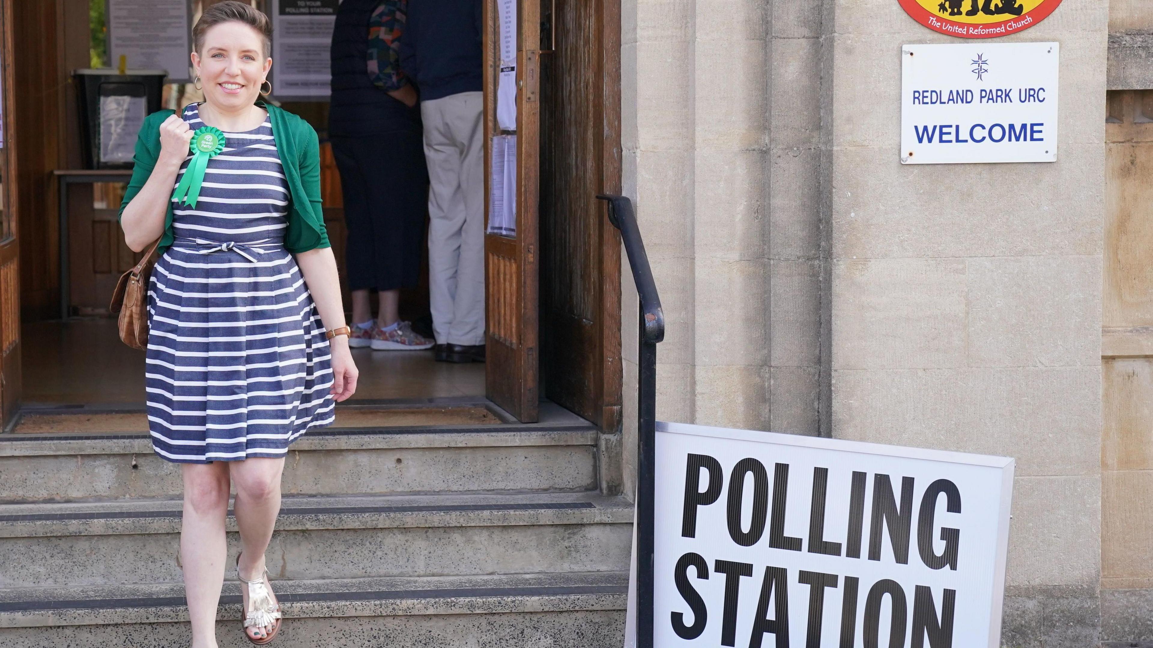 Carla Denyer walking down the steps outside a polling station in Redland