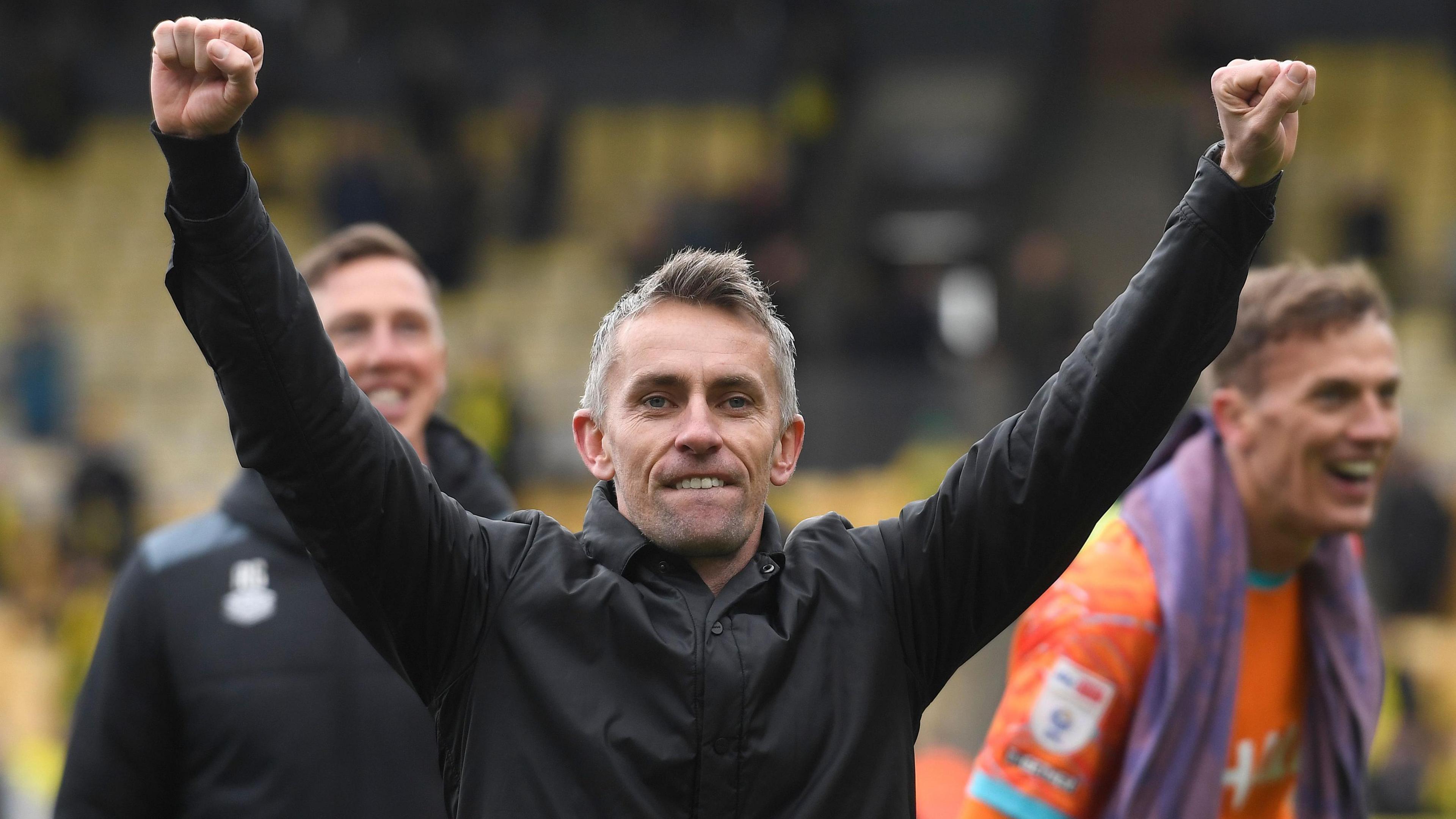 Ipswich manager Kieran McKenna raises his arms aloft as he celebrates beating rivals Norwich at Carrow Road for the first time in 20 years.
