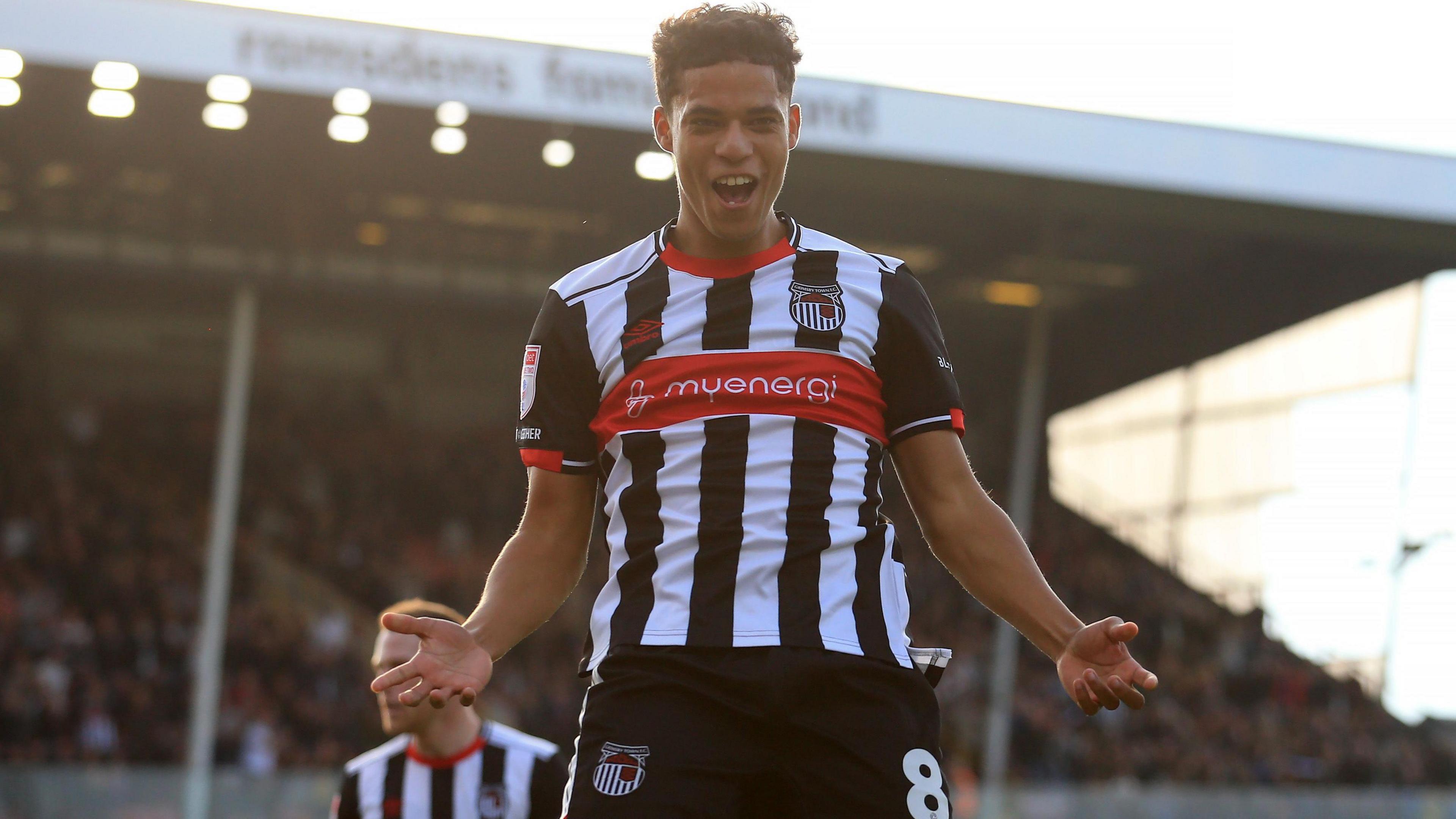 Evan Khouri celebrates scoring for Grimsby