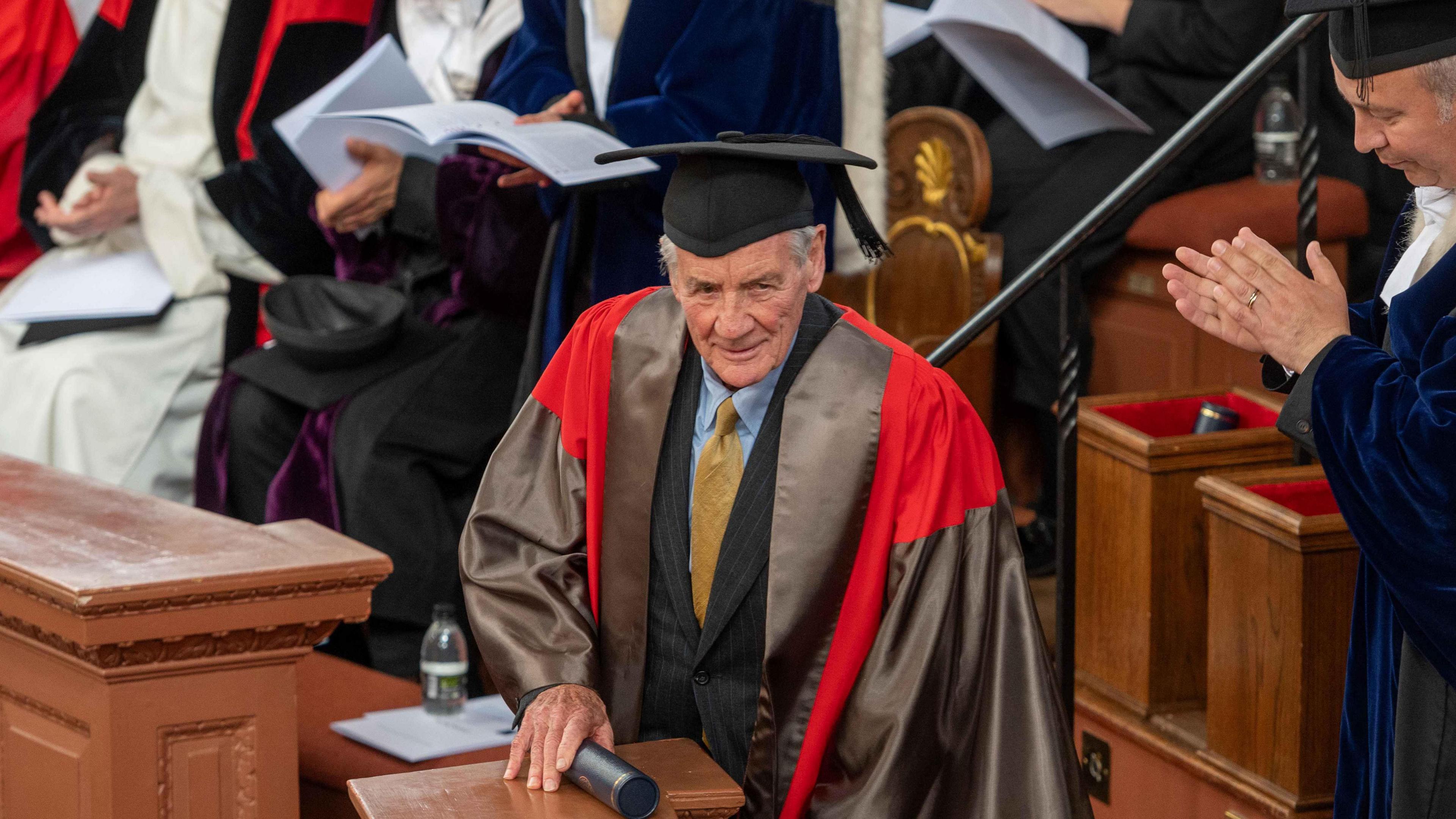 Michael Palin in traditional gowns