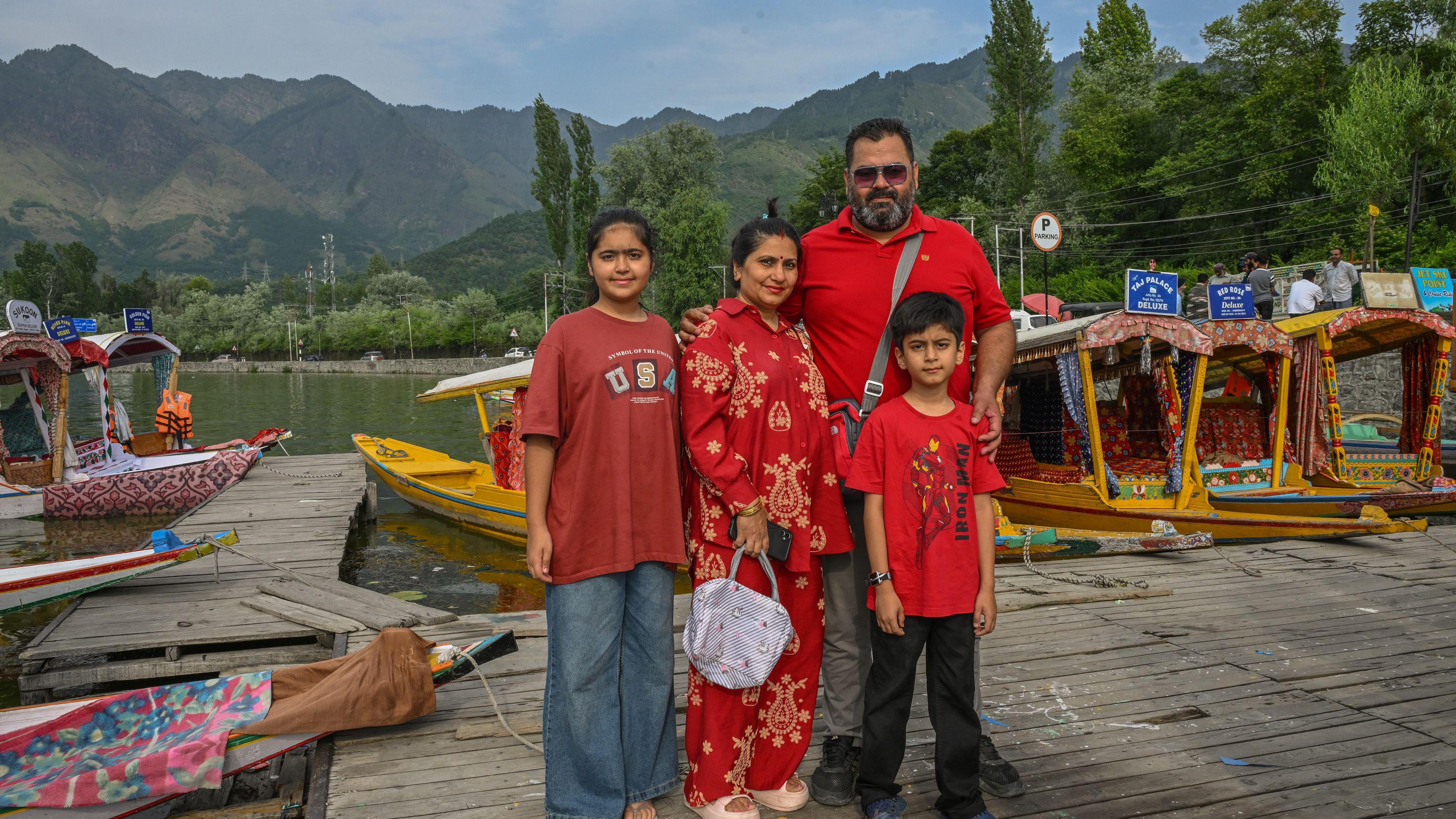 Anuj and Deepti Gandhi with their daughter Ragini (13) and son Mayank (8) pose for a photograph wearing clothes in varying shades of red.