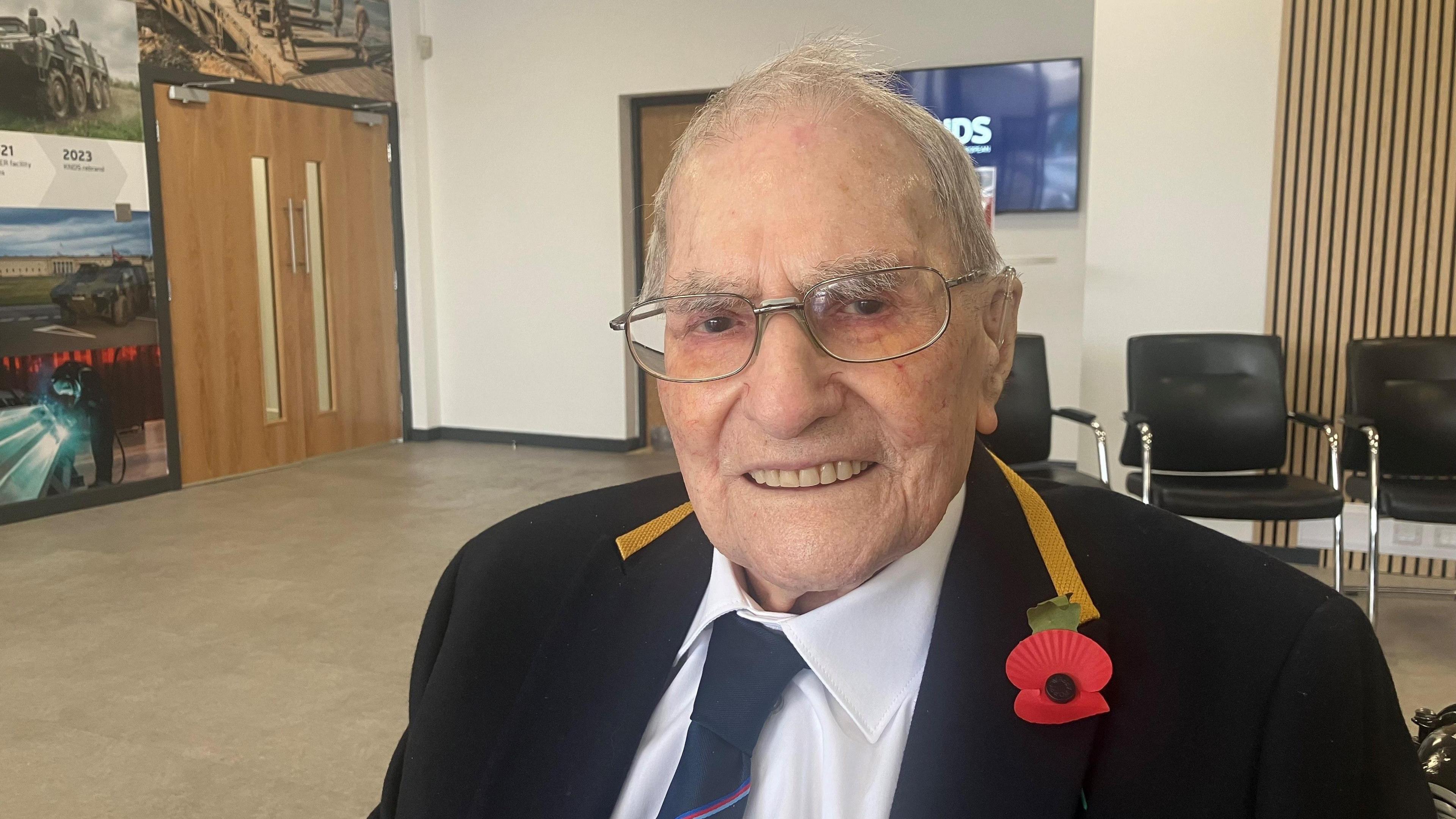 Photograph of 102 year-old Joe Jervis from Reddish. He is pictured at a former aircraft factory in Heaton Chapel