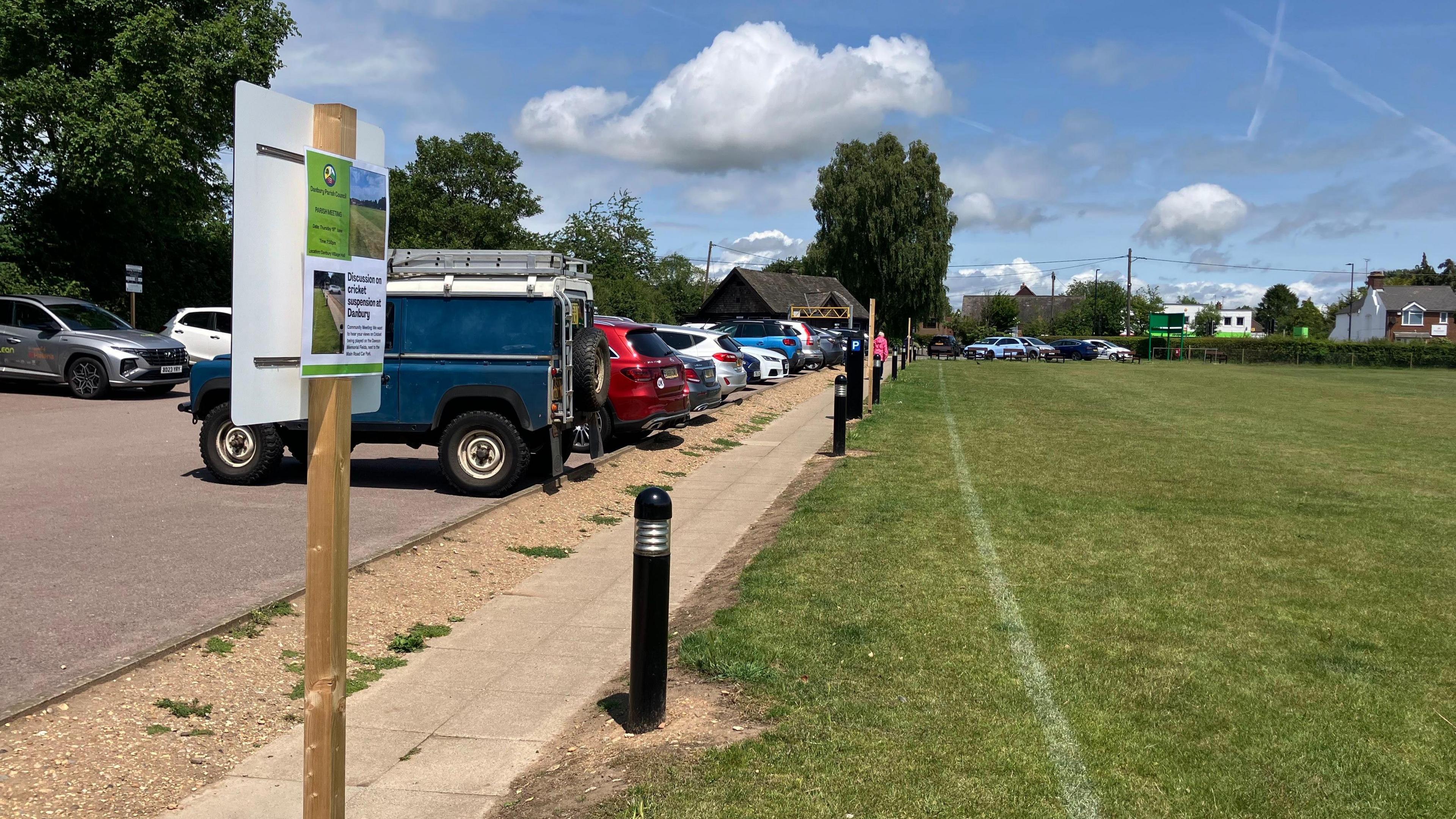A general view of the edge of the cricket field's boundary at Dawson Fields and the adjacent public car park