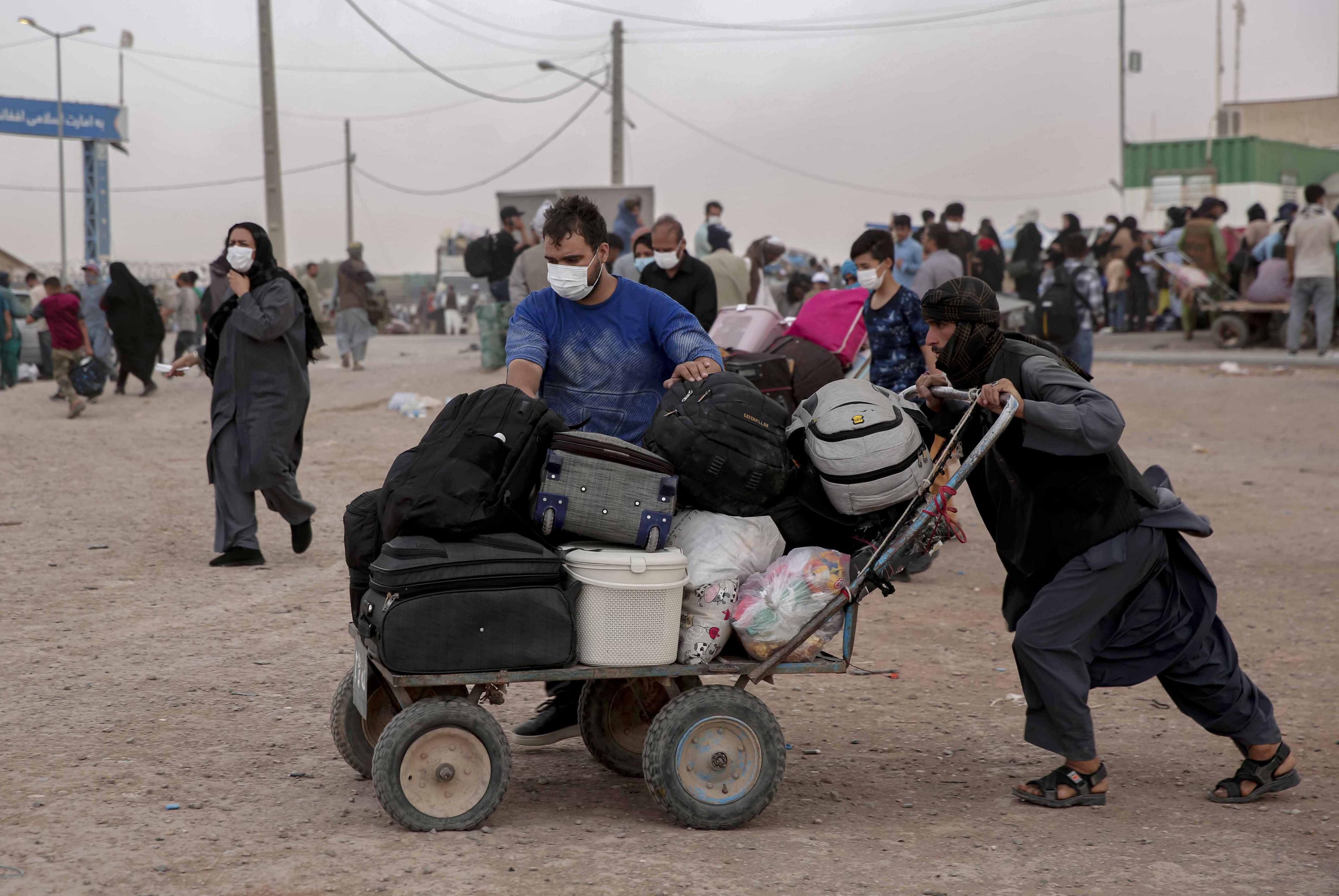 Afghans return from Iran at Islam Qala border in Herat, Afghanistan.