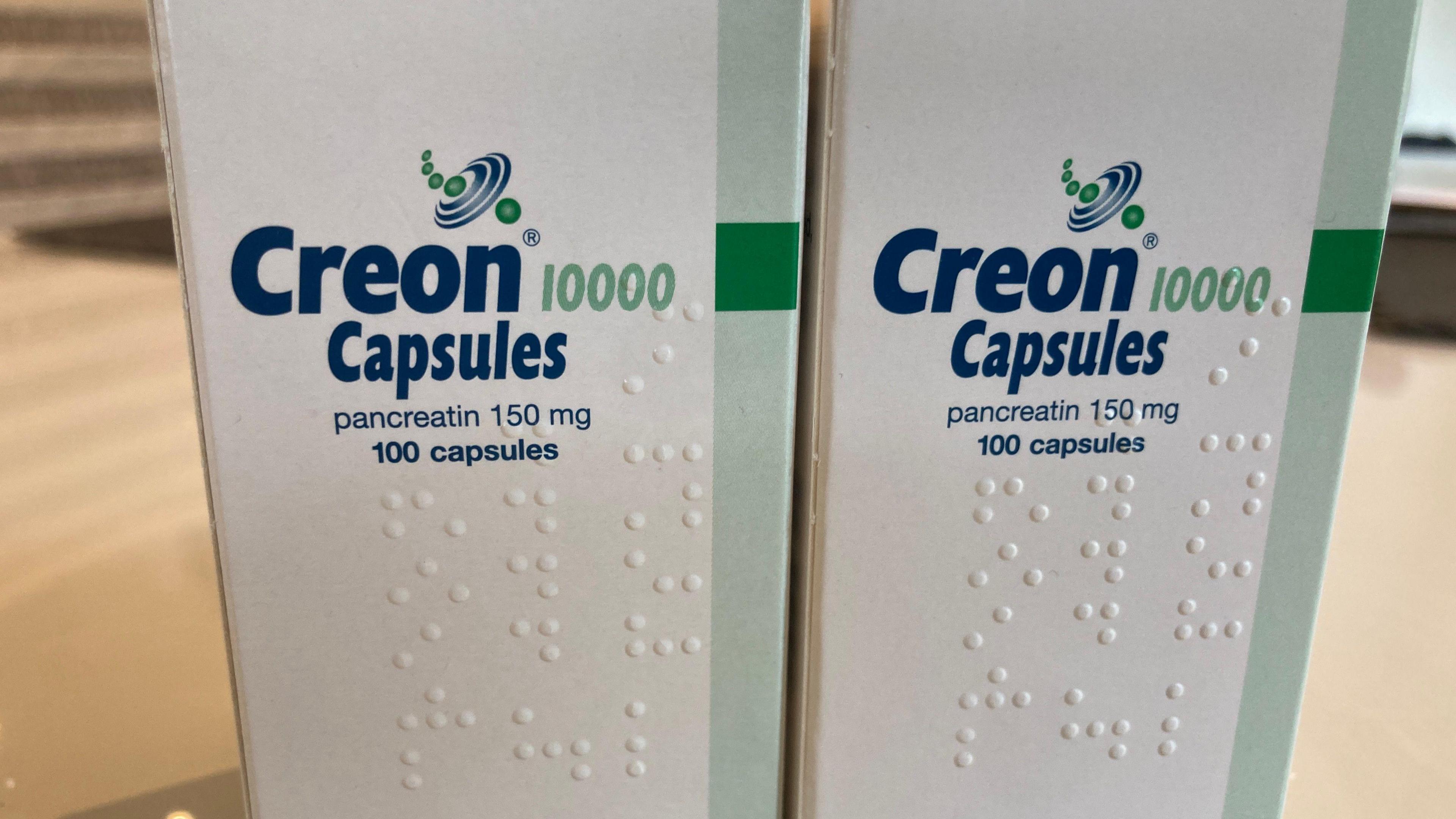 Two boxes that say Creon Capsules on them.