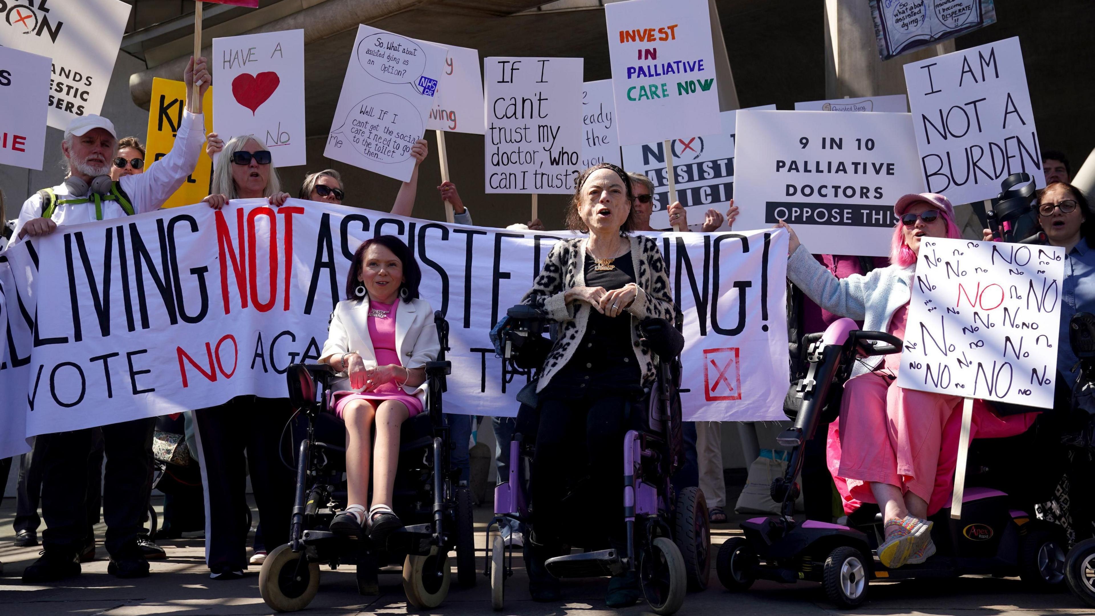 Actress Liz Carr (right) and Pam Duncan-Glancy MSP with members of the Glasgow Disability Alliance, demonstrating outside the Scottish Parliament in Edinburgh, ahead of the debate and vote on the Assisted Dying for Terminally Ill Adults (Scotland) Bill