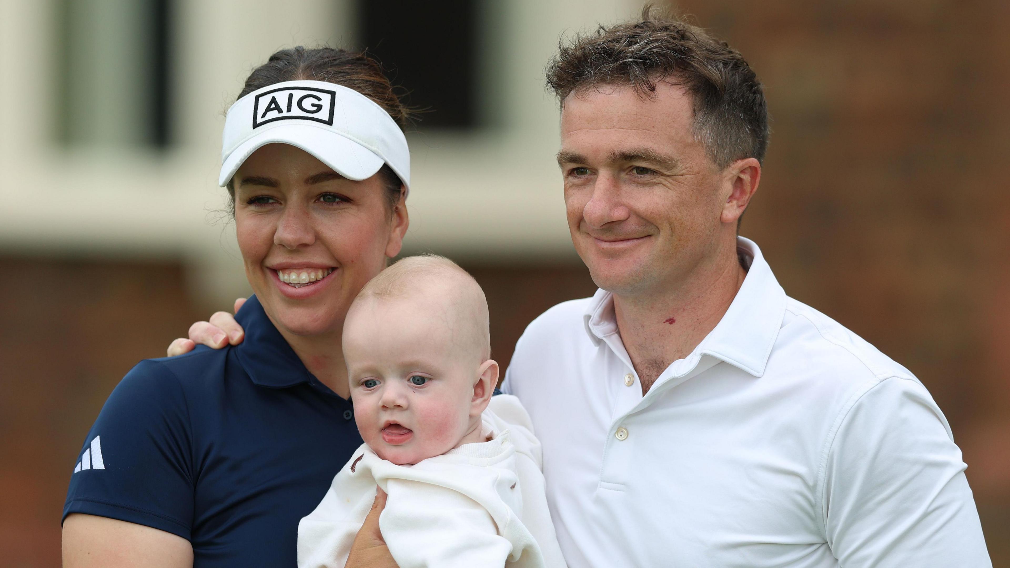 Georgia Hall (left) poses for a photo with son Conor (centre) and fiance Paul Dunne (right) at Royal Lytham and St Annes