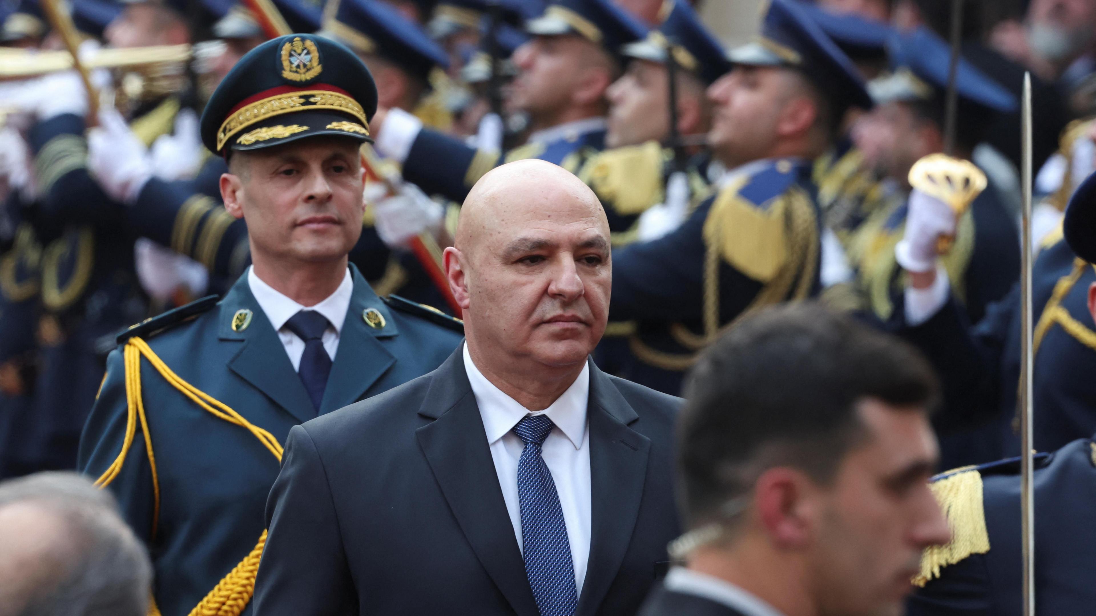 Joseph Aoun (C) inspects troops outside Lebanon's parliament building in Beirut (9 January 2025)