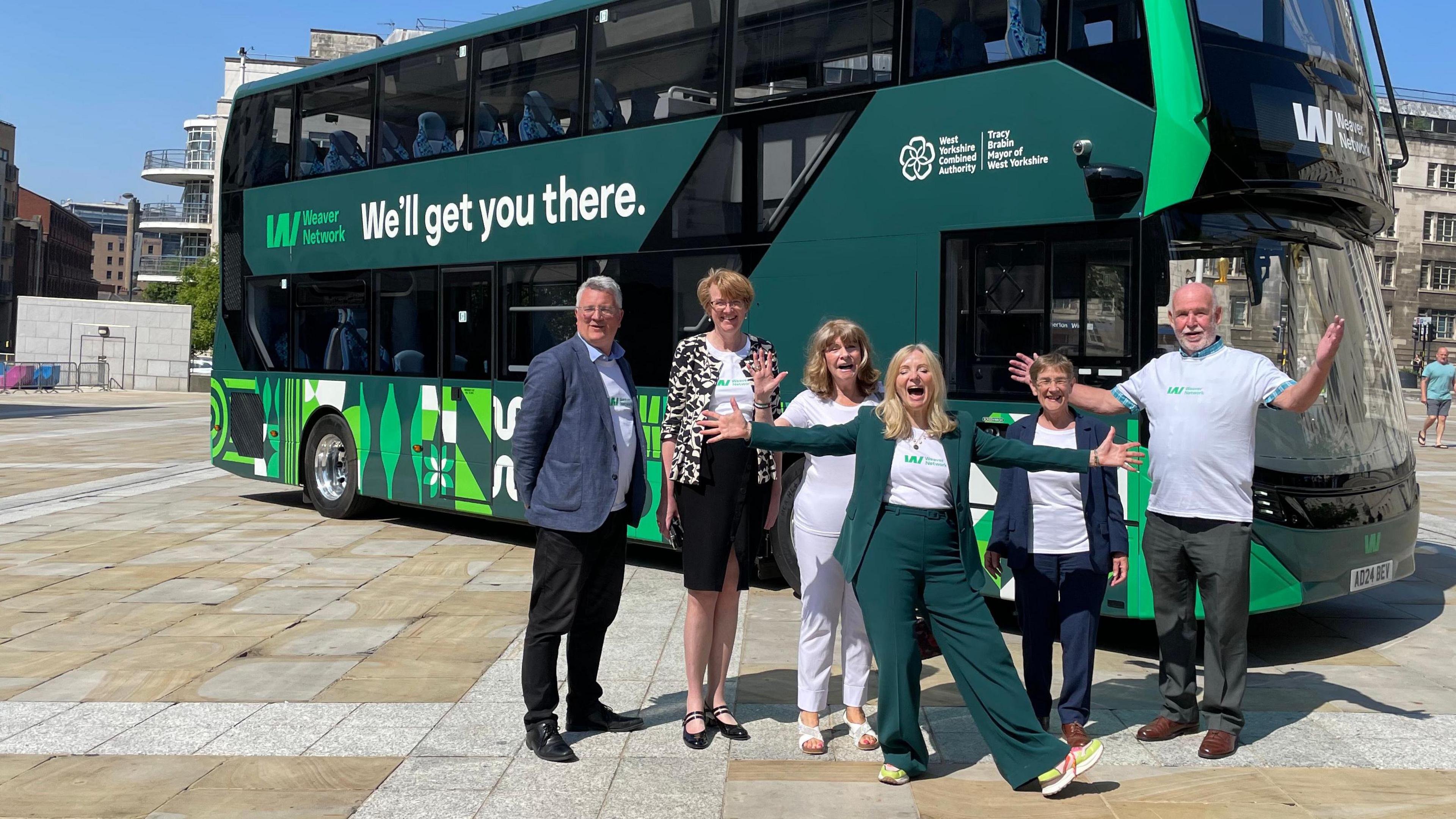 Six people standing in front of a bus; the leaders of Bradford, Calderdale, Kirklees, Leeds and Wakefield Councils, (Susan Hinchcliffe, Jane Scullion, Carole Pattison, James Lewis and Denise Jeffery) plus West Yorkshire Mayor Tracy Brabin, unveiling West Yorkshire's new Weaver transport network in Leeds.