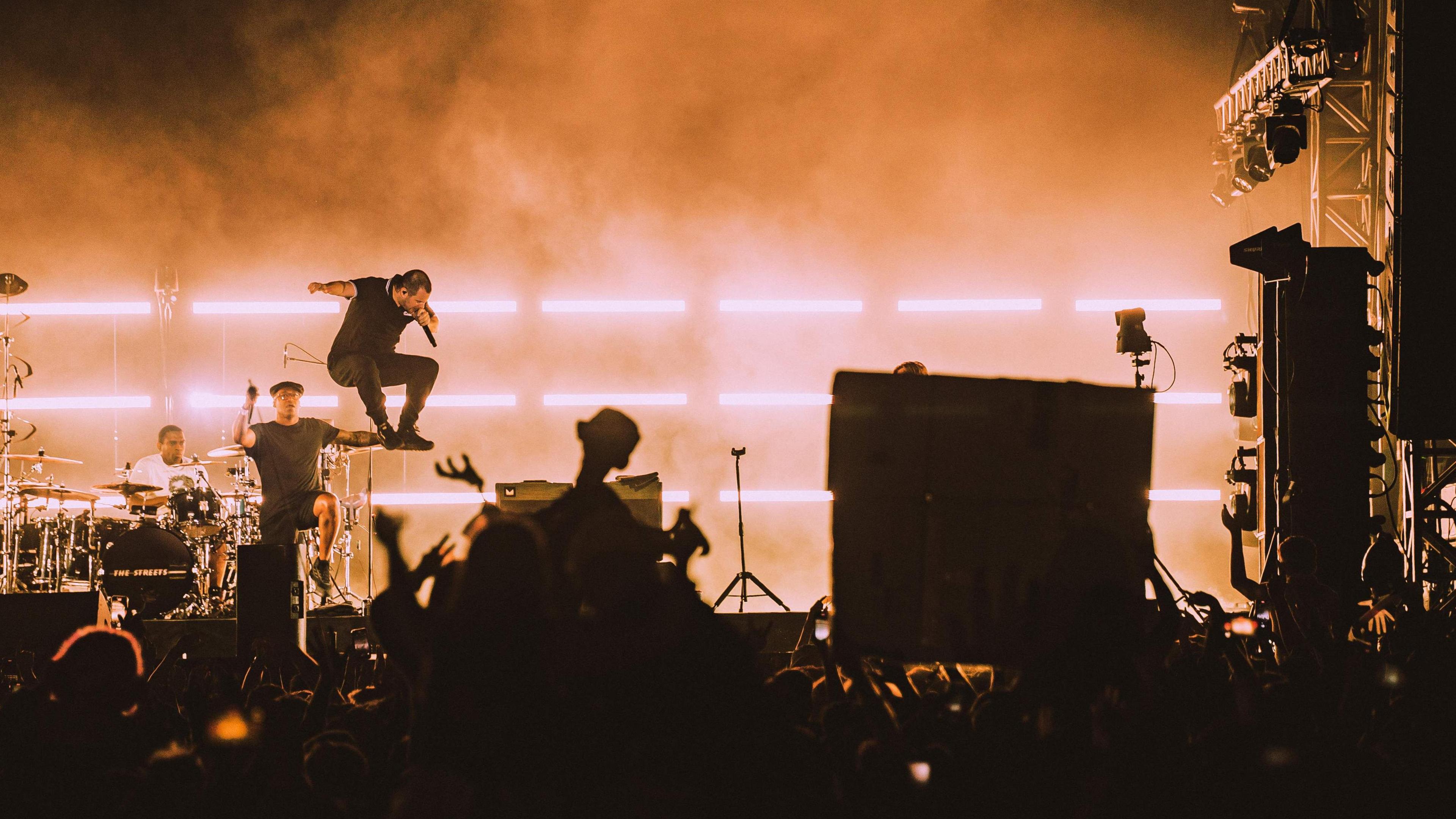 Mike Skinner leaps high into the air during The Streets set.