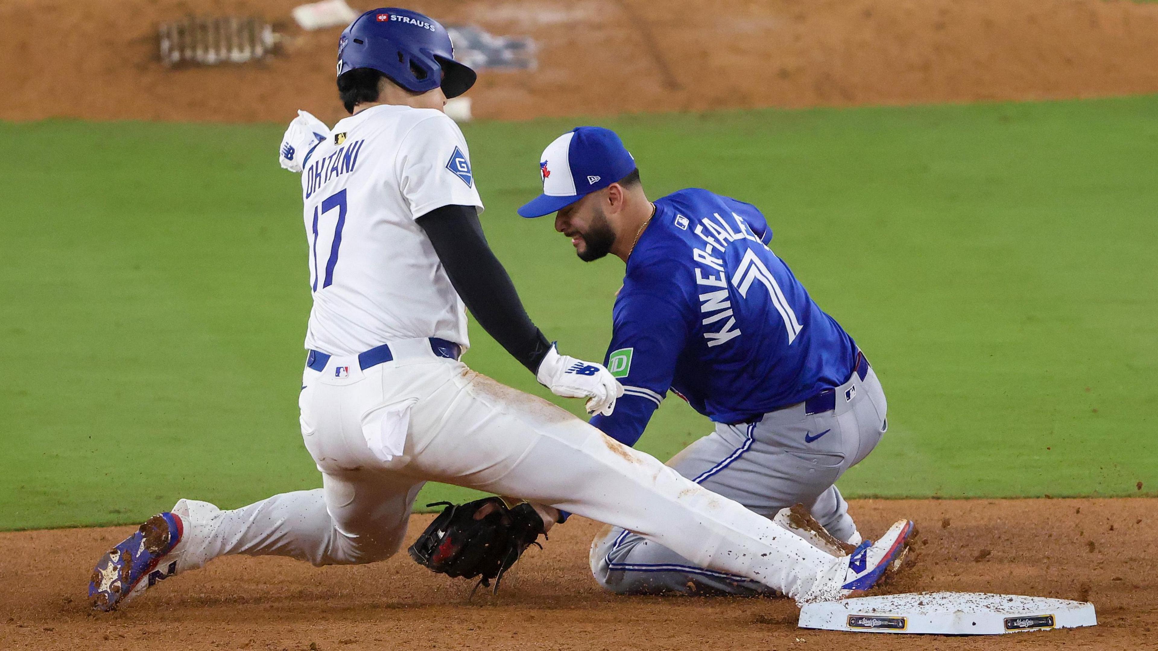 Los Angeles Dodgers designated hitter Shohei Ohtani is tagged out by Isiah Kiner-Falefa while attempting to steal second base in the ninth inning