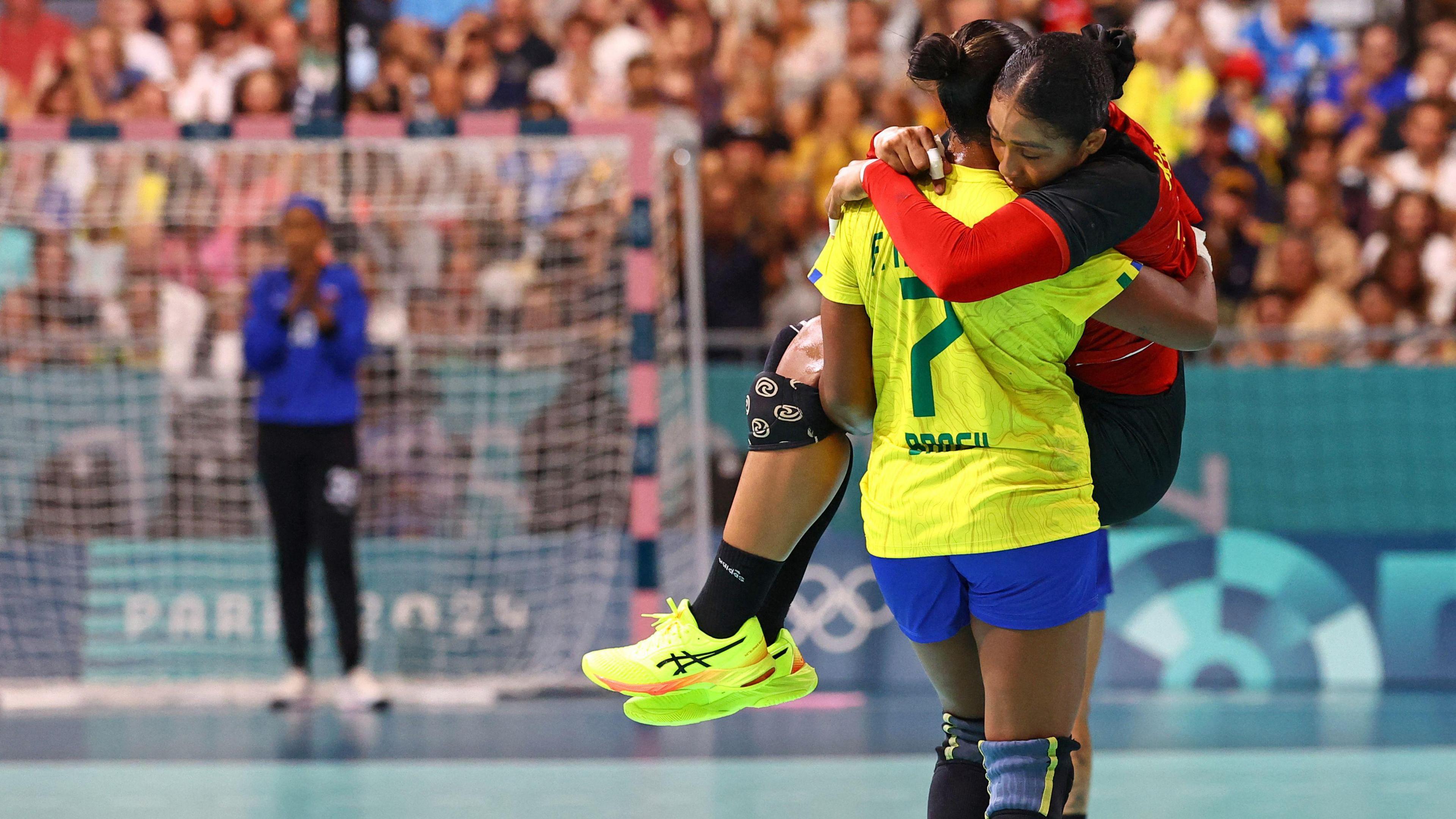 Angola's captain Albertina Kassoma was carried off the pitch by Brazil's Tamires Araujo Frossard