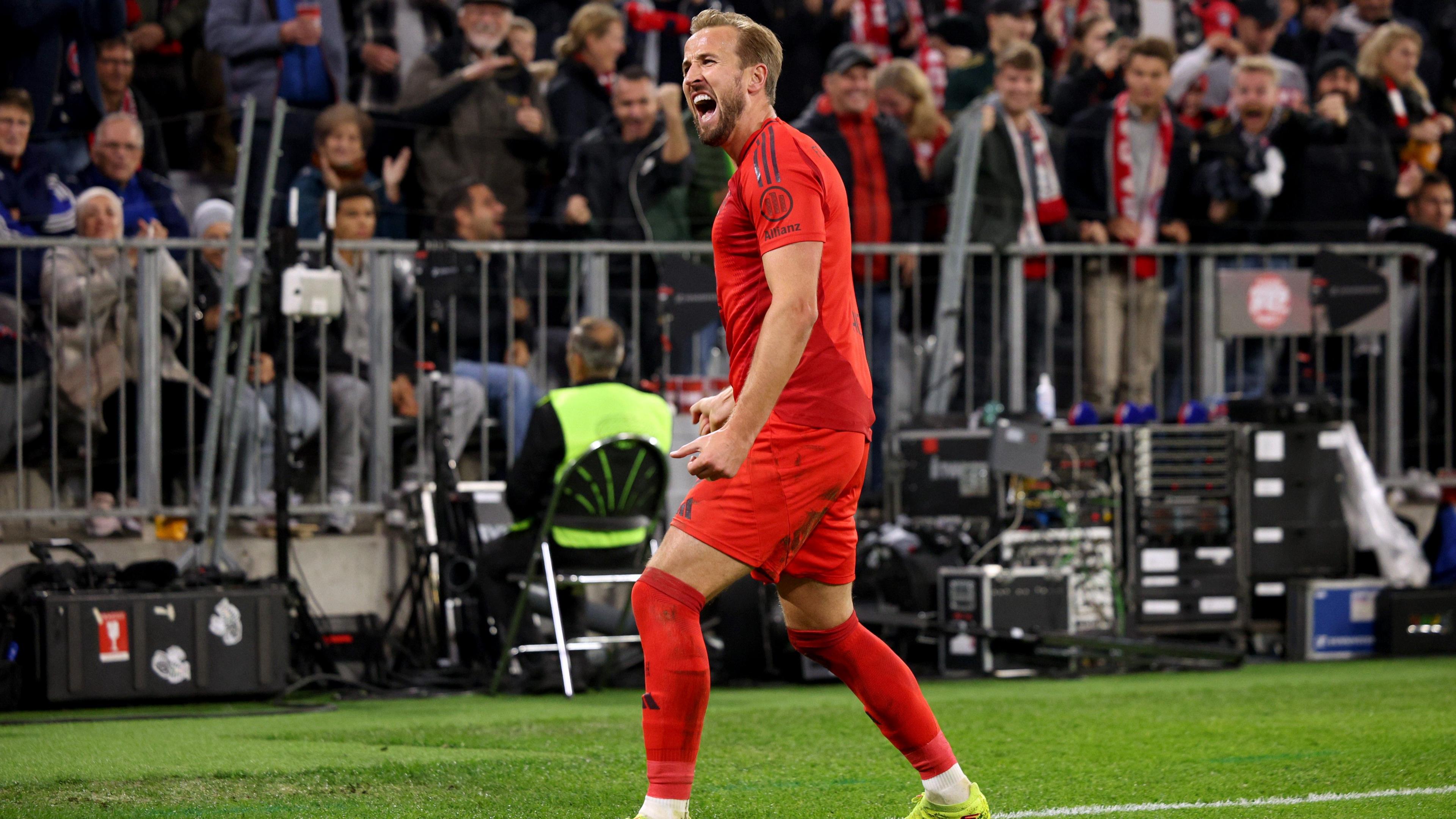 Harry Kane celebrates after scoring against Stuttgart