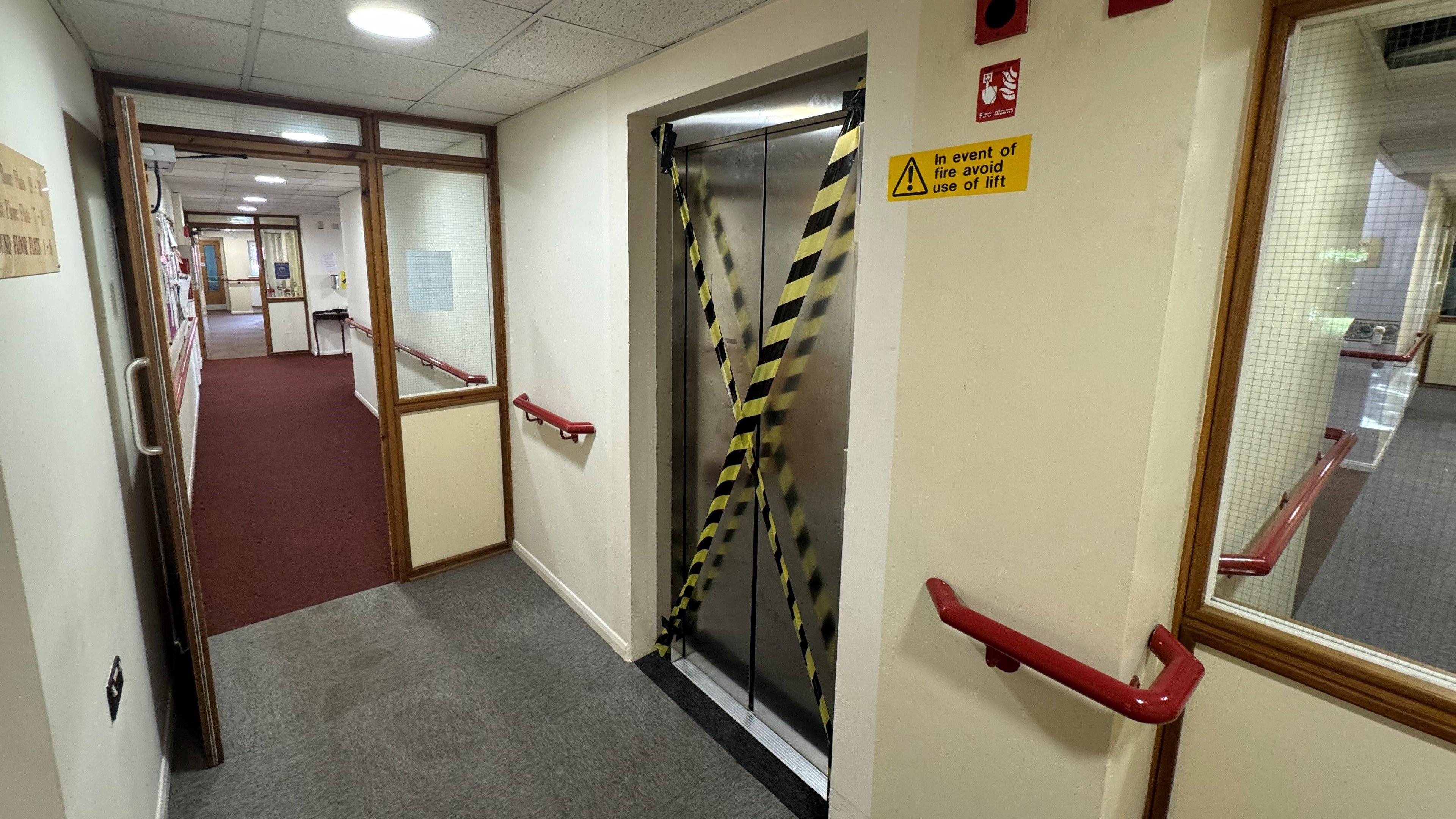 The lift door covered in tape