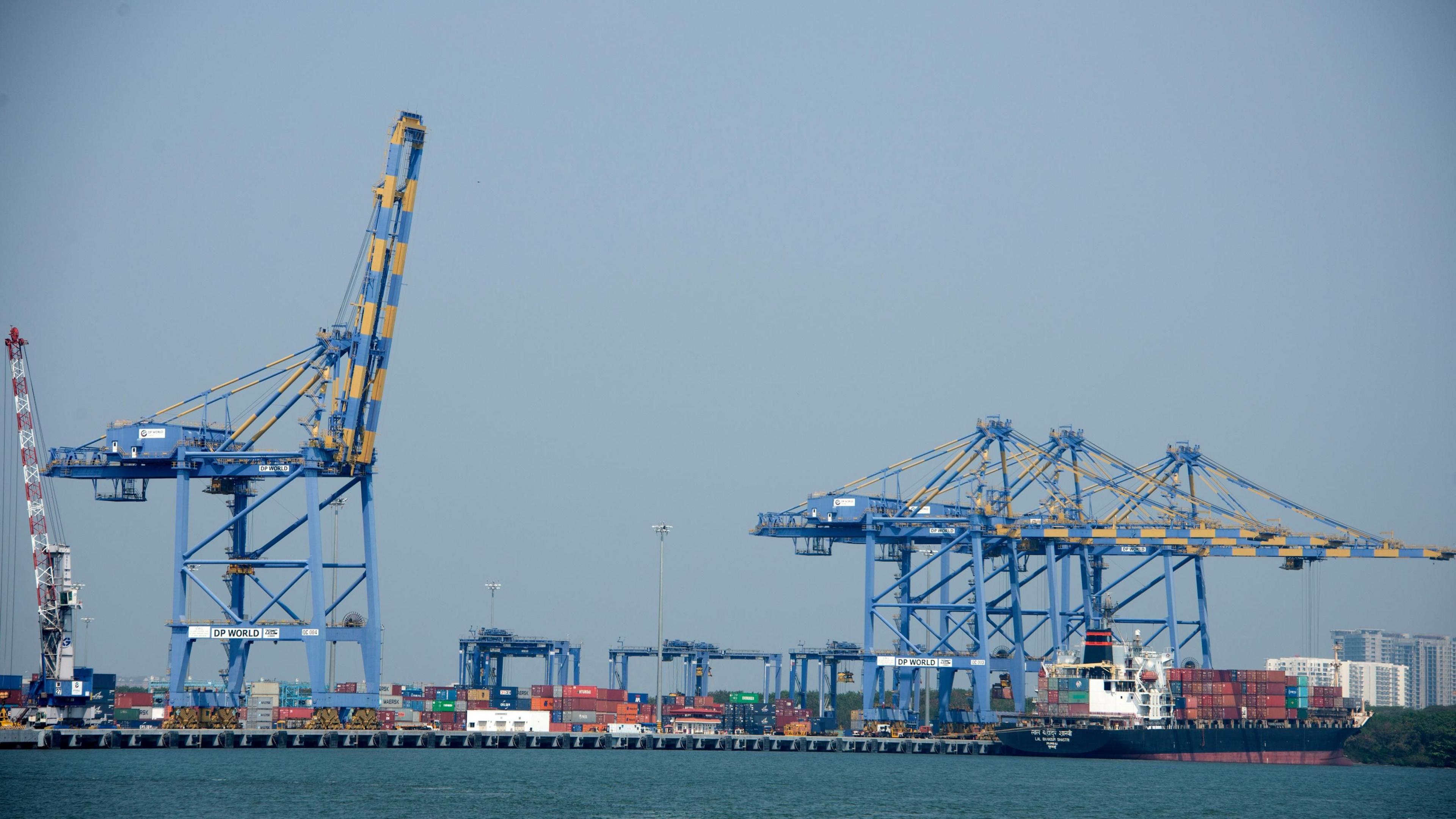 Kochi docks and shipping container port in Kochi (also known as Cochin), India. Kochi, is a major port city on the south west coast of India by the Laccadive Sea and is part of the district of Ernakulam in the state of Kerala.
