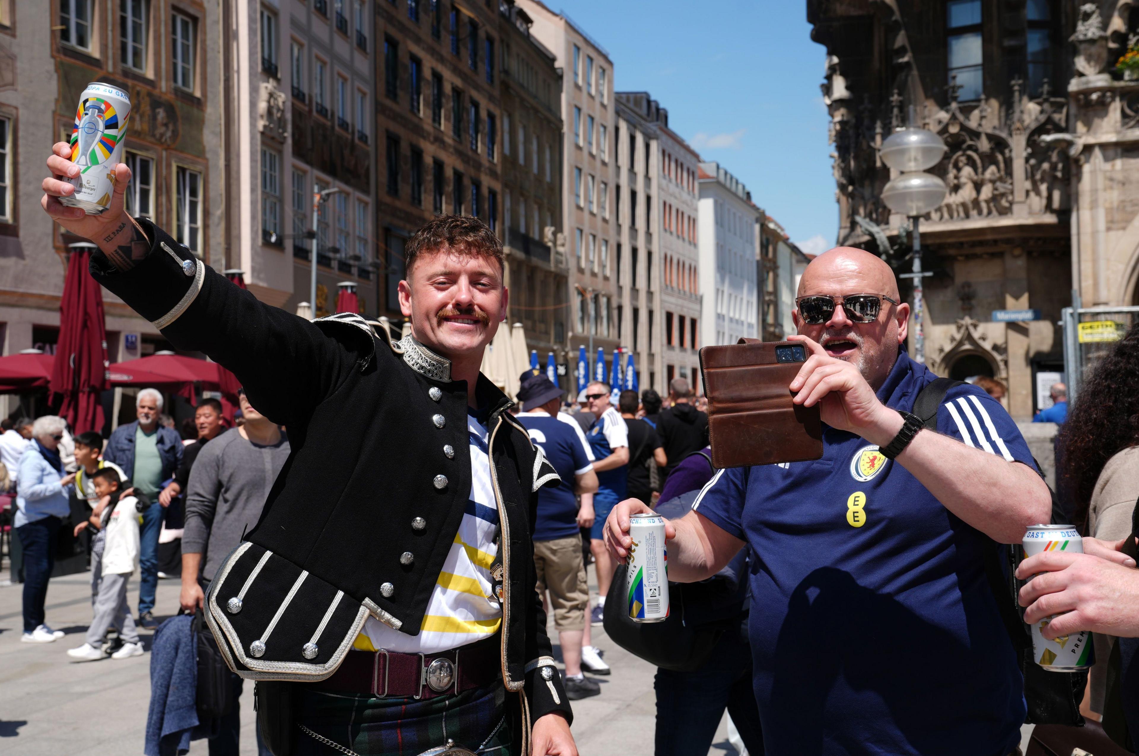 Fans drinking cans of beer